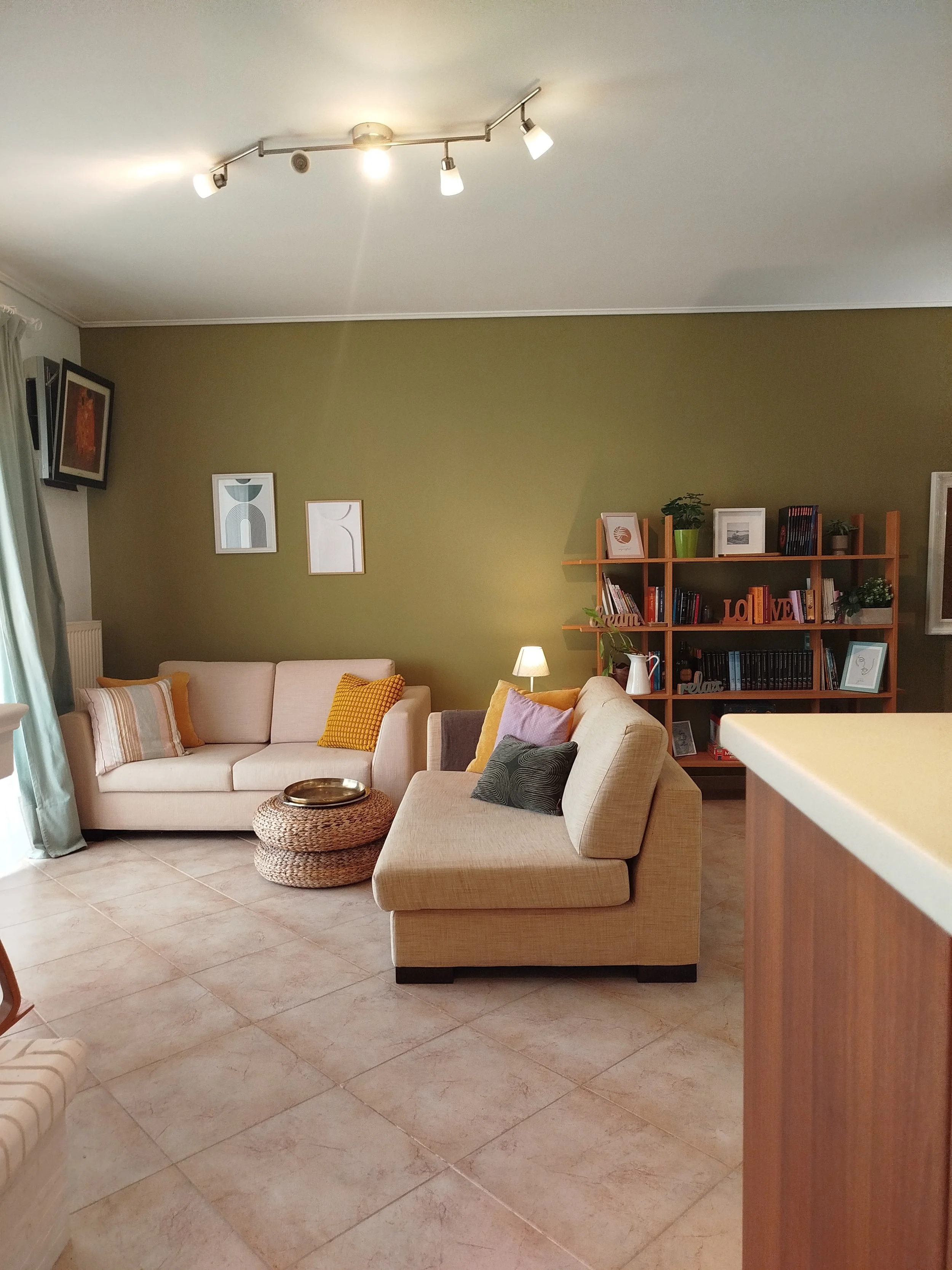 Elegant fully furnished living room with modern decor and sea view windows in Salamina apartment.