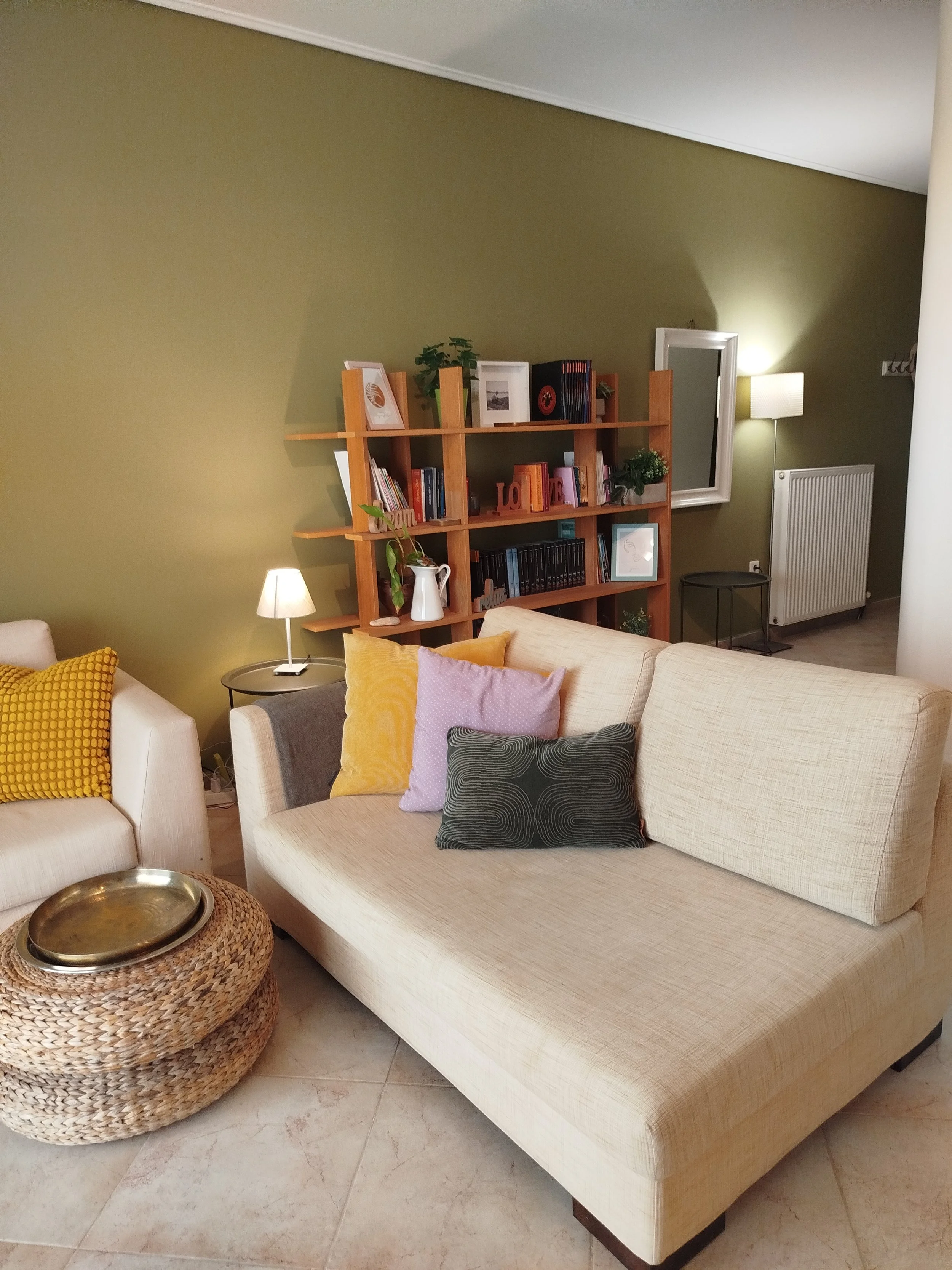 Elegant fully furnished living room with modern decor and sea view windows in Salamina apartment.