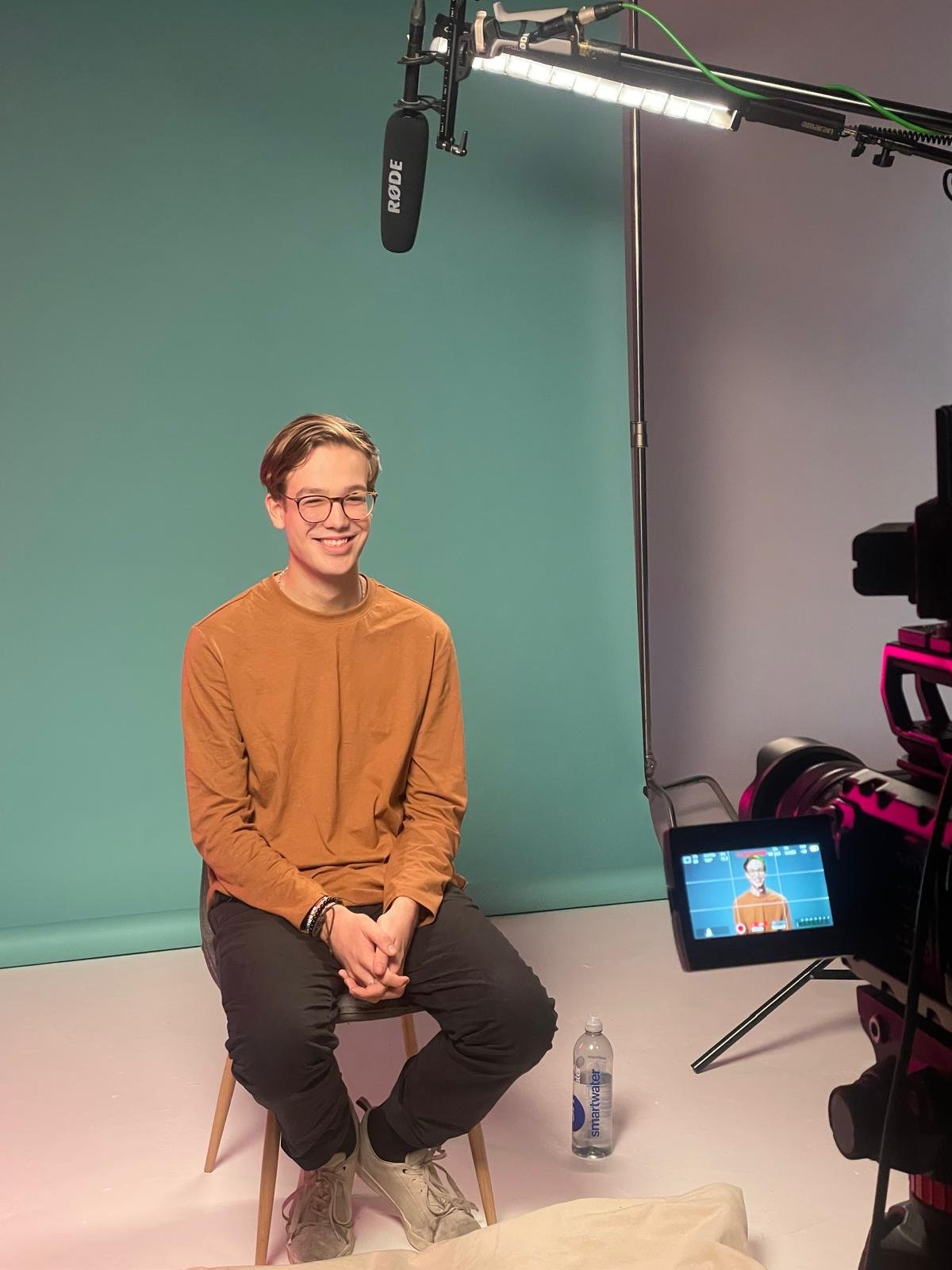 Conor Warren sat in front of a camera