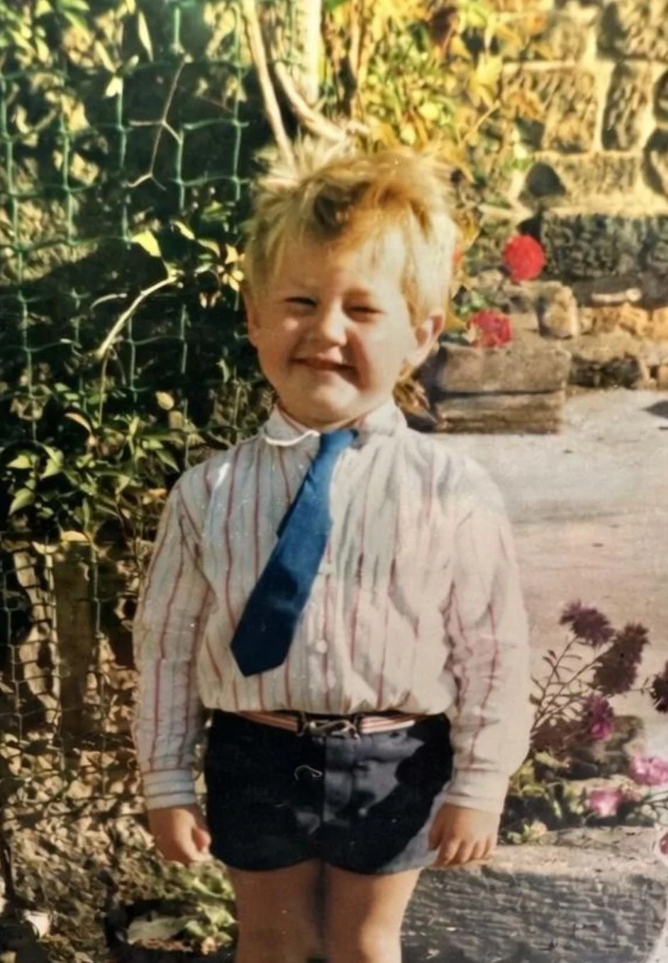 Paul Jones as a child, Wearing a shirt and a blue tie