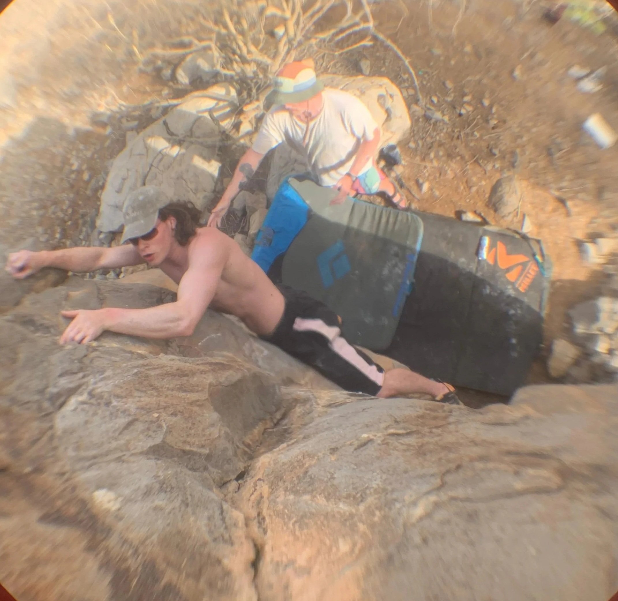 Bouldering a rock in the Al Hajar mountains, Oman