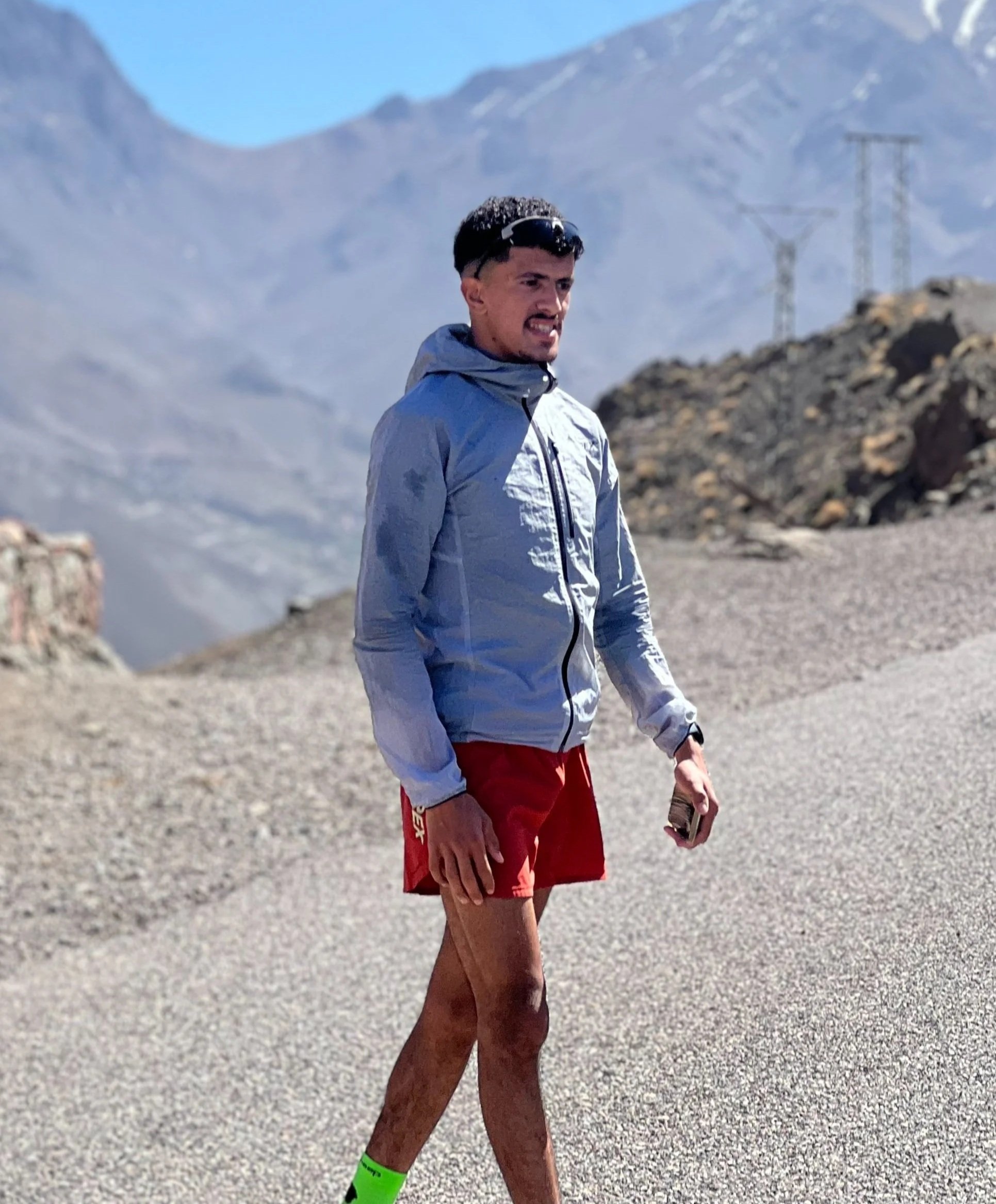 Trail runner looking out over Imlil, High Atlas mountains, Morocco
