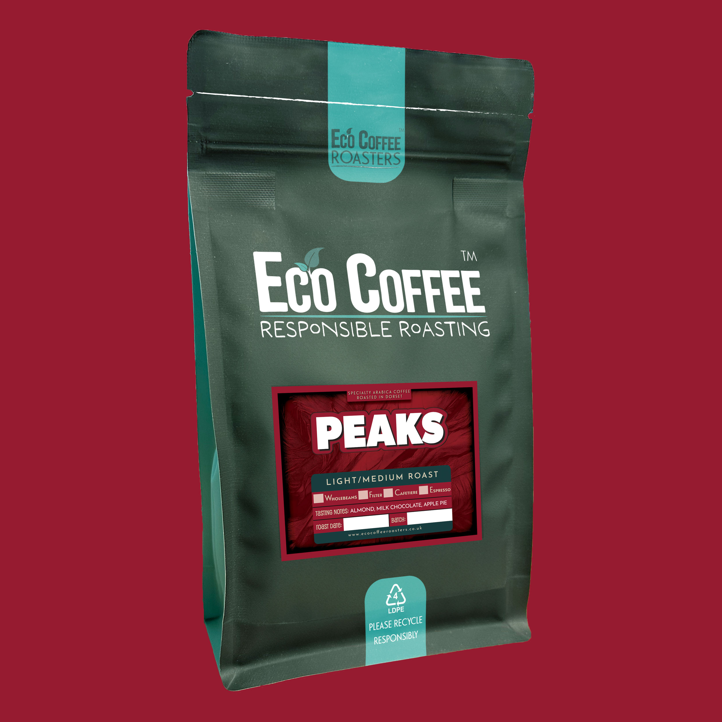 Bag of Eco Coffee "Peaks" light-medium roast with snowy mountains and red curtains background.