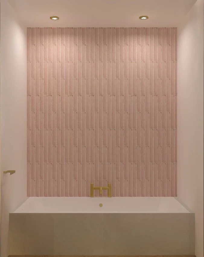 A minimalist bathtub against a pink tiled wall with ceiling spotlights and a gold faucet.