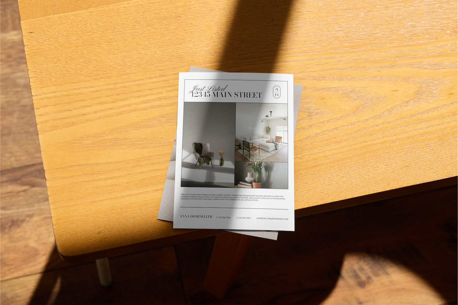 Real estate flyer on a wooden table with interior and exterior images of a house.