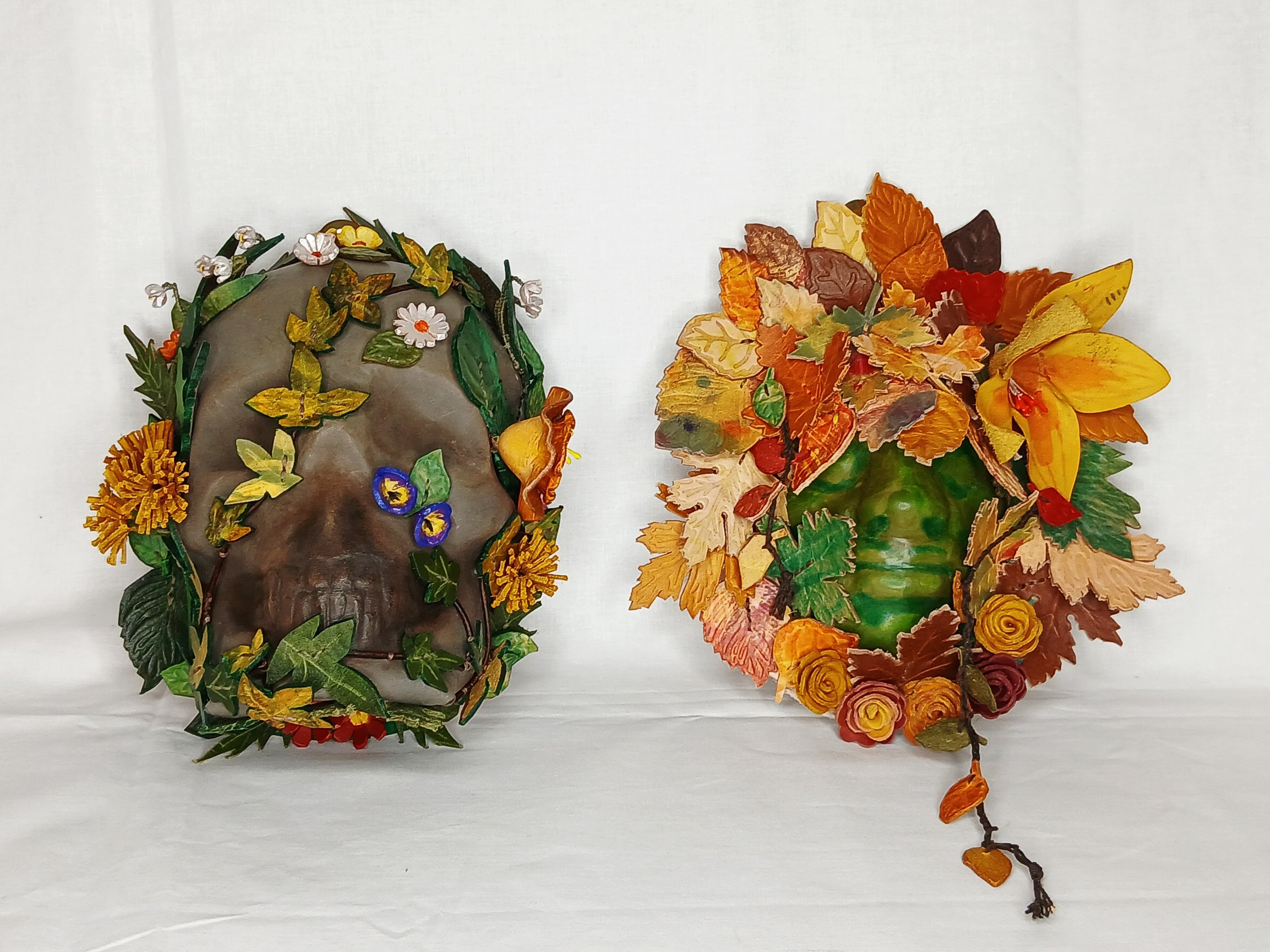 𝗡𝗮𝘁𝘂𝗿𝗲'𝘀 𝗘𝘁𝗲𝗿𝗻𝗮𝗹 𝗖𝘆𝗰𝗹𝗲 — A captivating pair of companion sculptures contrasting the delicate blooms of spring and life against the rich, hand-carved textures of autumn foliage.