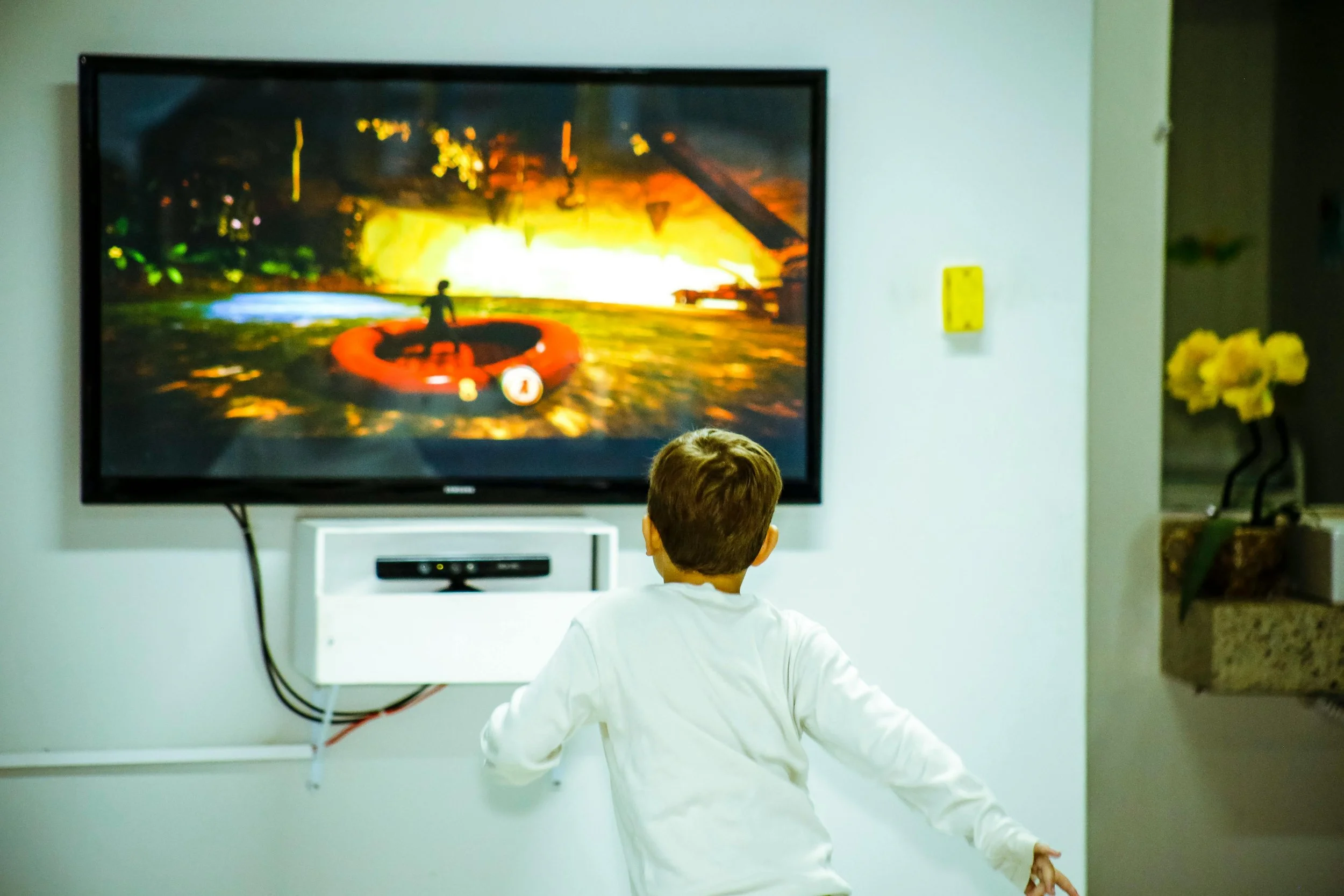 Kid watching TV on a clean TV