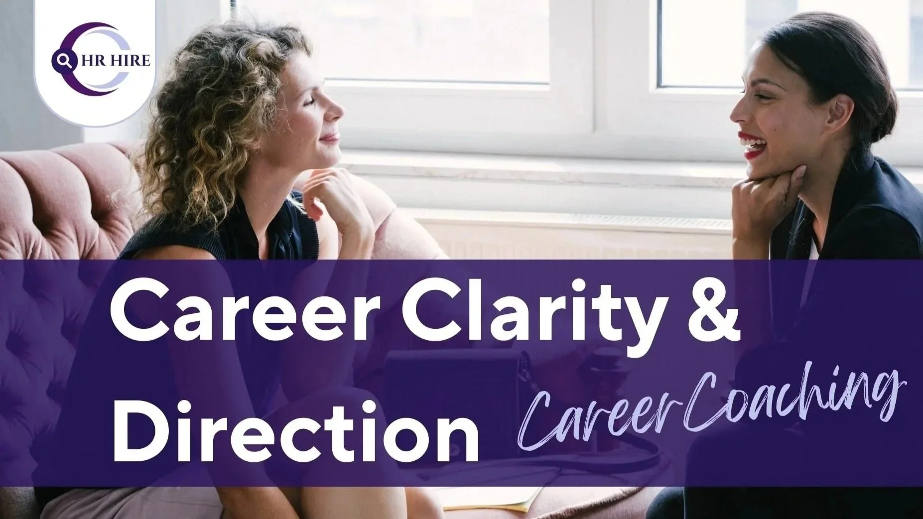 Group of four diverse smiling people sitting in a bright office with large windows, with a purple banner below them that reads "Career Clarity & Direction" in white text.