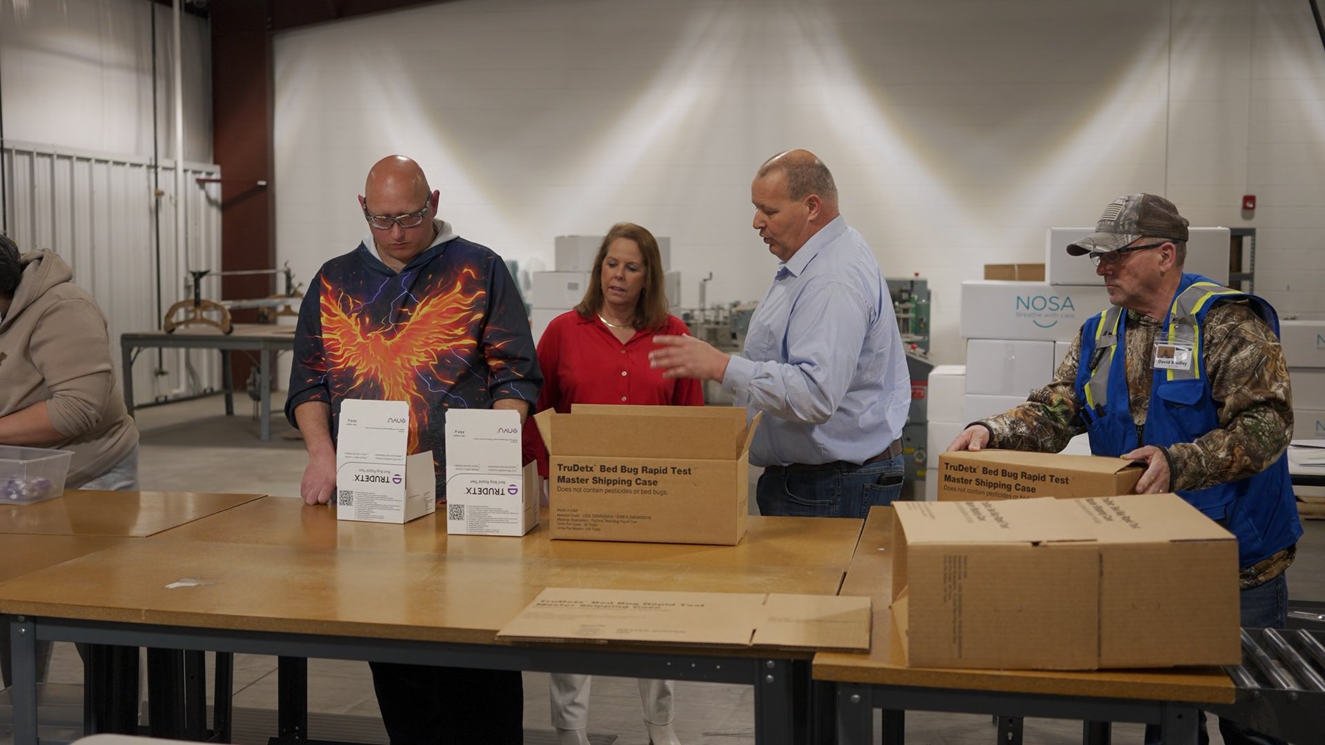 Able Solutions team reviewing a customer's packaging spec against retailer requirements