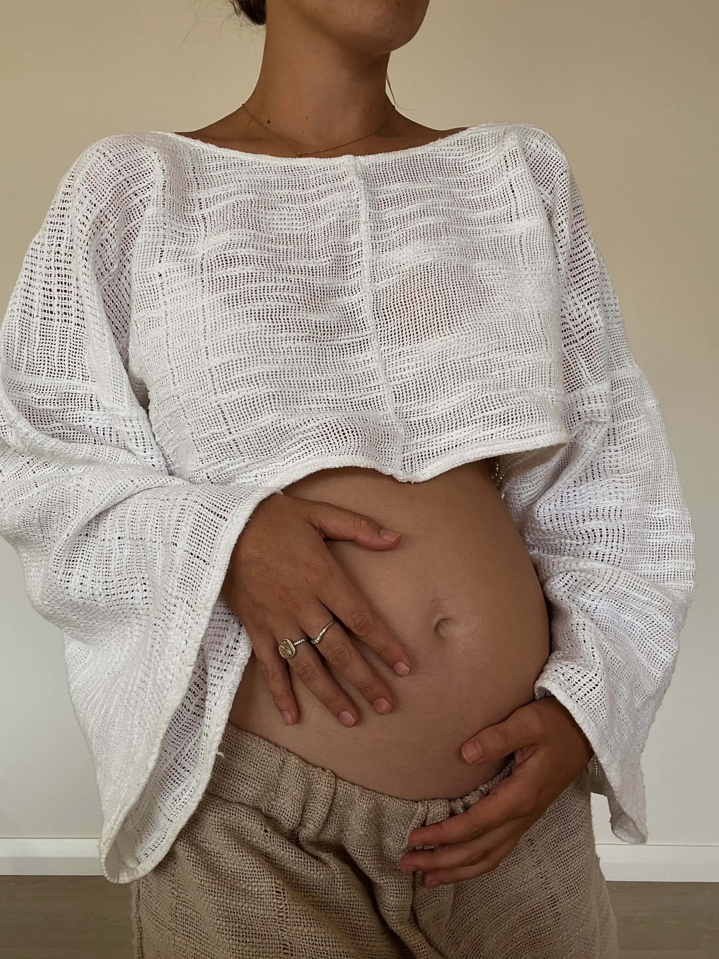 Pregnant mother connecting with her changing body during pregnancy and motherhood in Frederick, MD