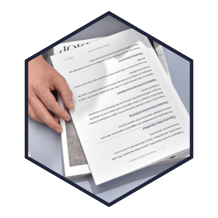 Hexagon shape image, showing a close up of a page from a Jessanol recommendations report being read.