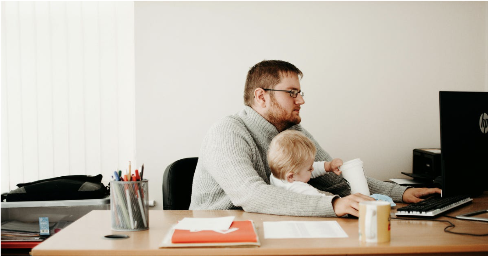 Dad parenting special needs children sitting trying to juggle work and family balance
