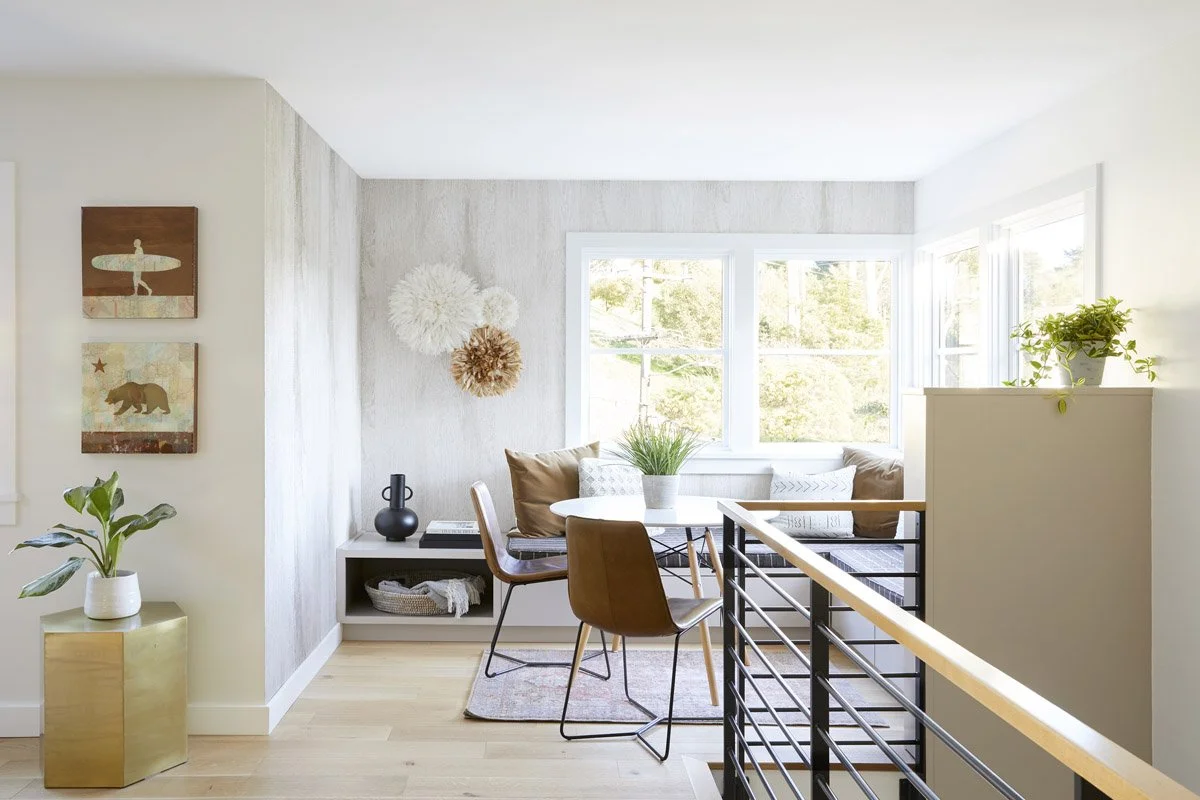 dining nook with wooden table, leather chairs and corner window bench