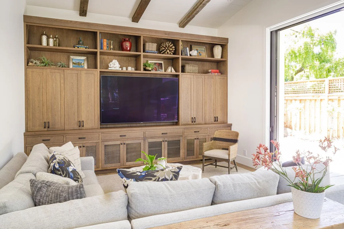 family room with wood built-in media wall and white sectional sofa