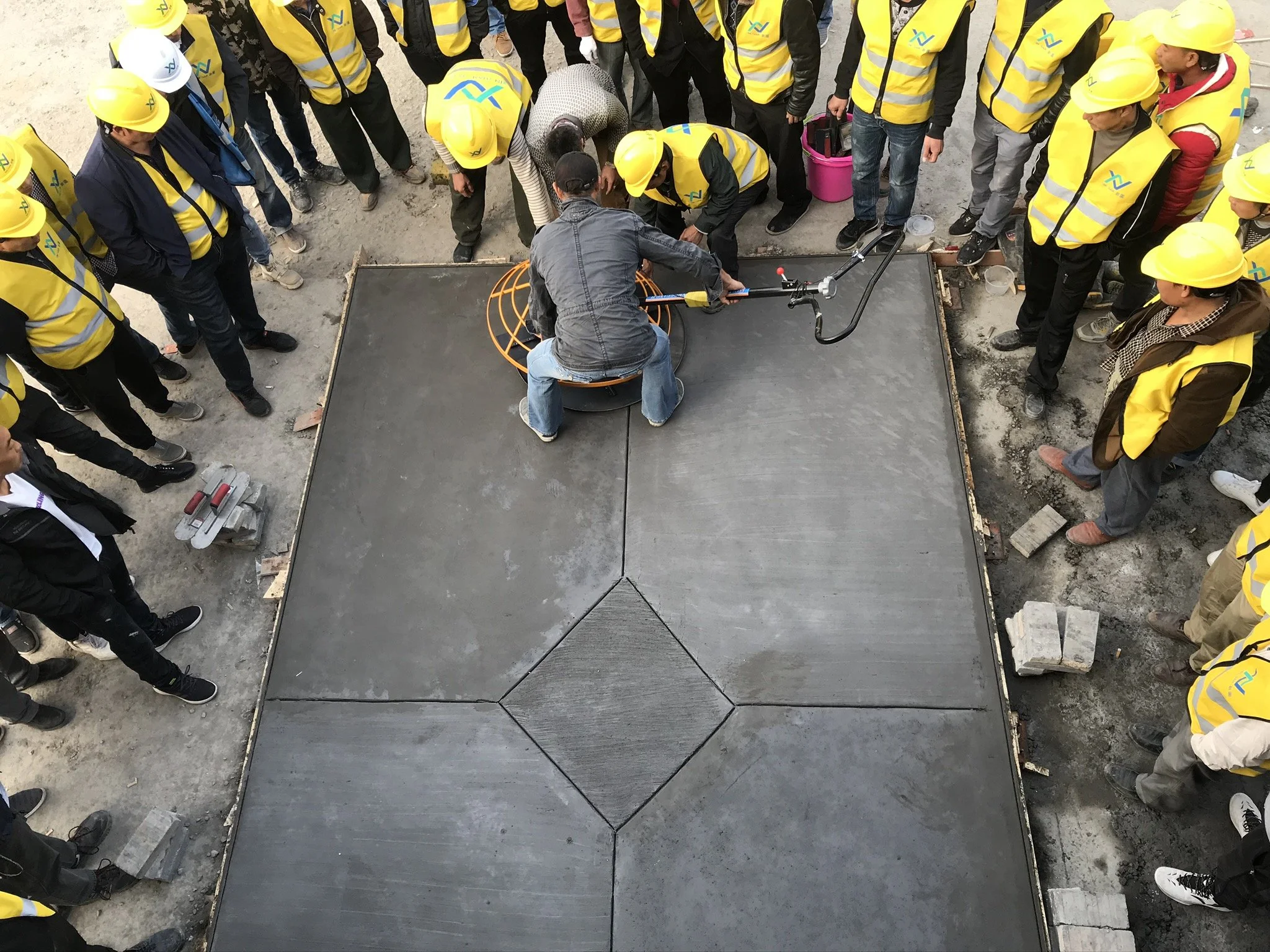 Matthew Casto does hands on concrete hardscape training.JPEG