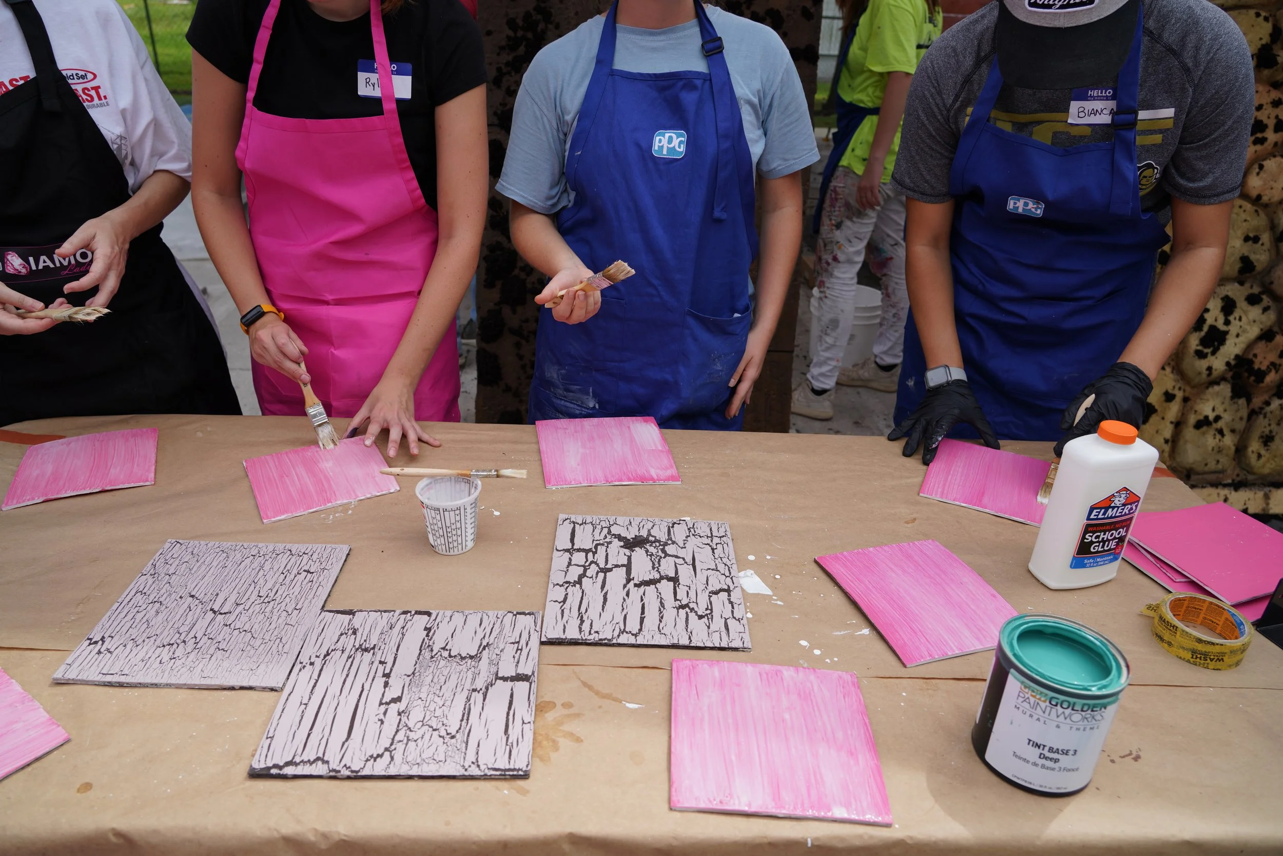 Students learn the crackle technique with elmers glue and paint.JPG