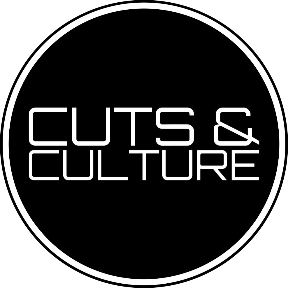Black circular logo with white border and text reading 'Cuts & Culture' in stylized neon font.