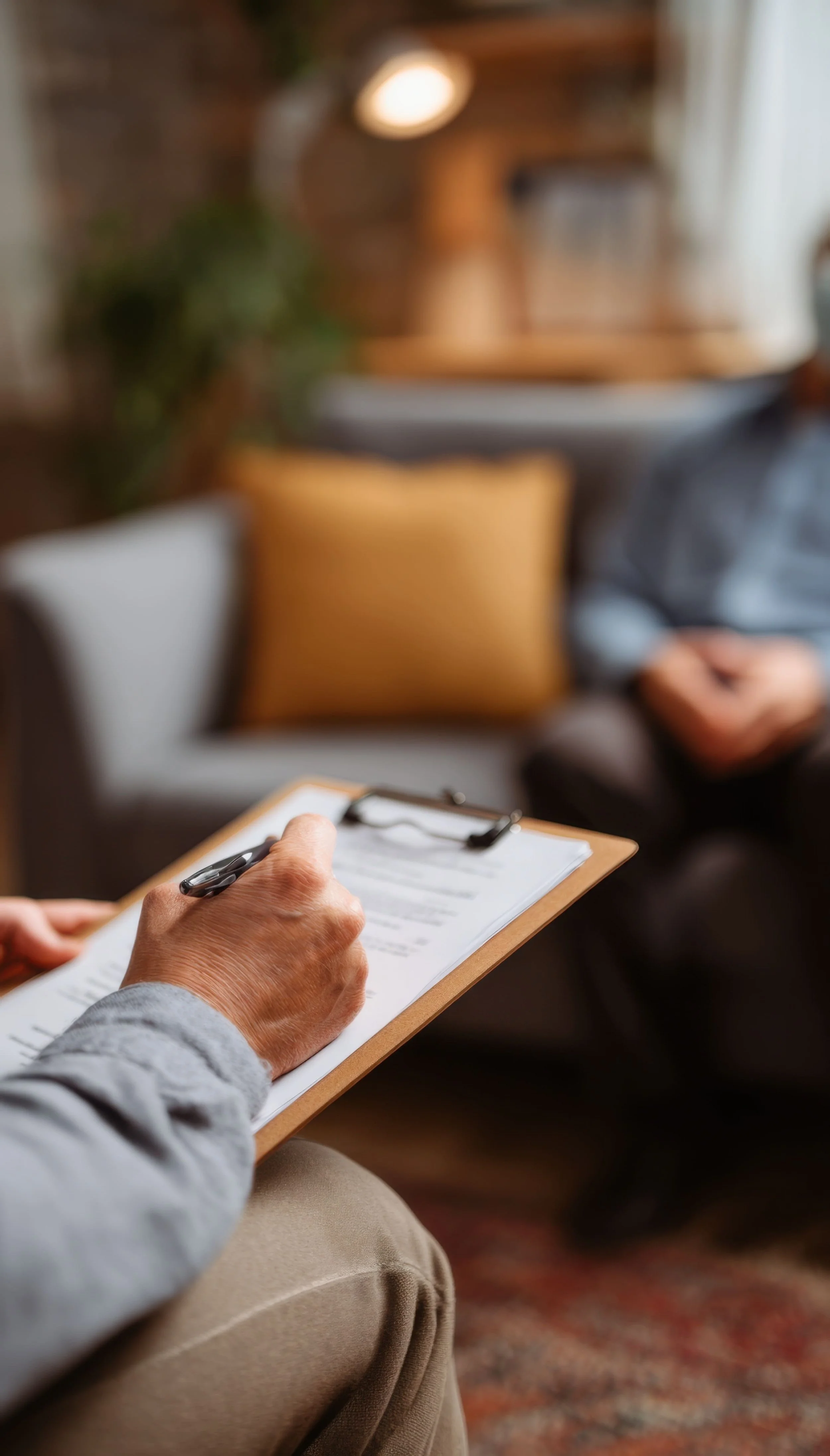Therapist taking notes during a counseling session in Wisconsin