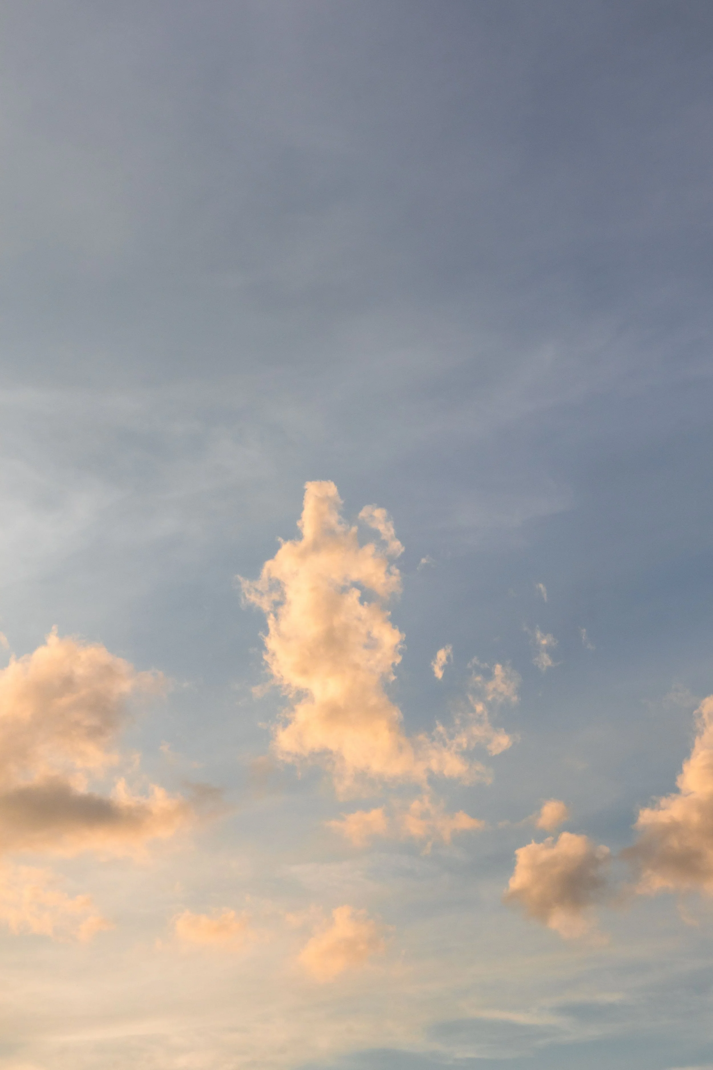 Soft sky with warm clouds at golden hour