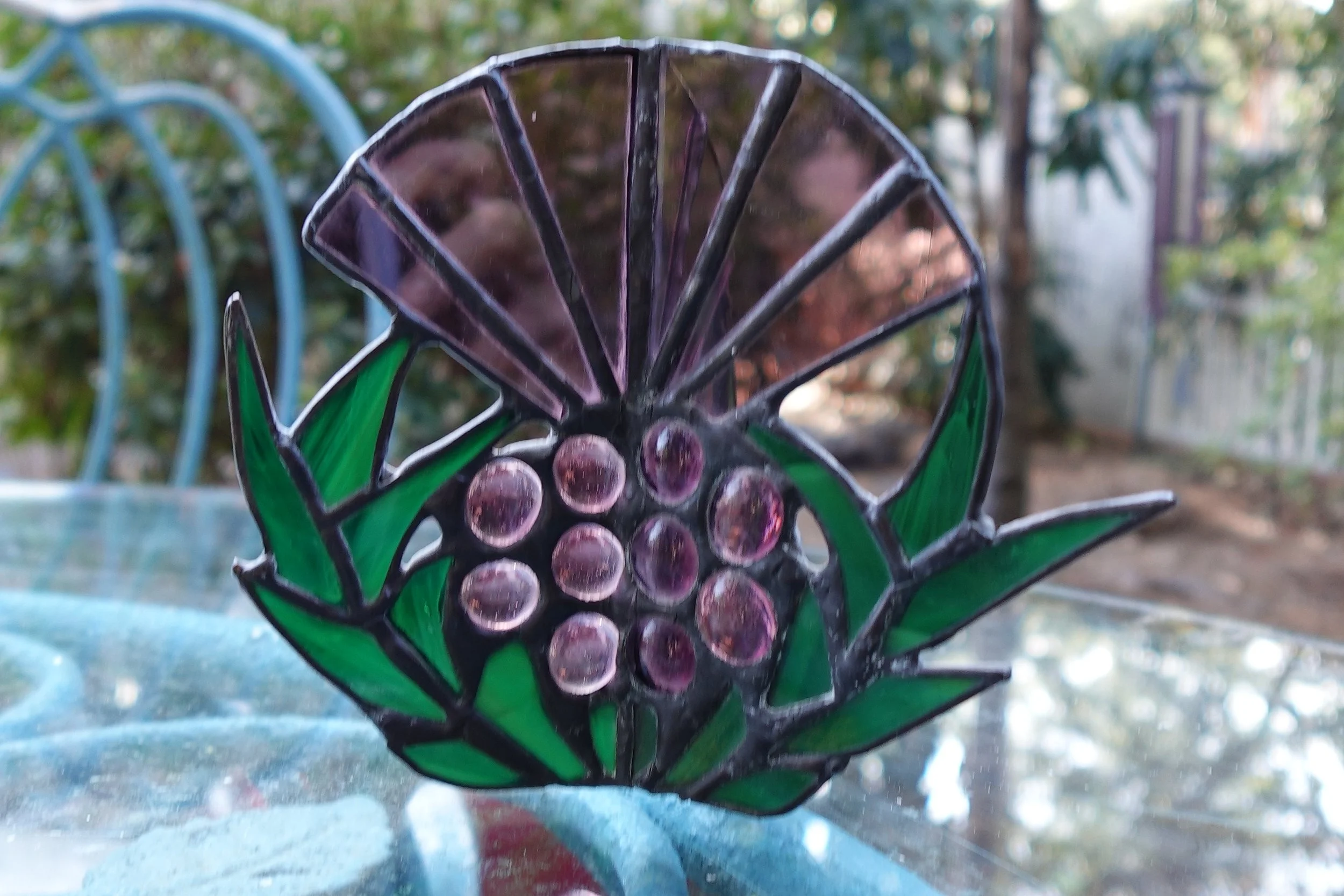 3 D Stained Glass Thistle on table outside Close Up Kim S Joy.JPG