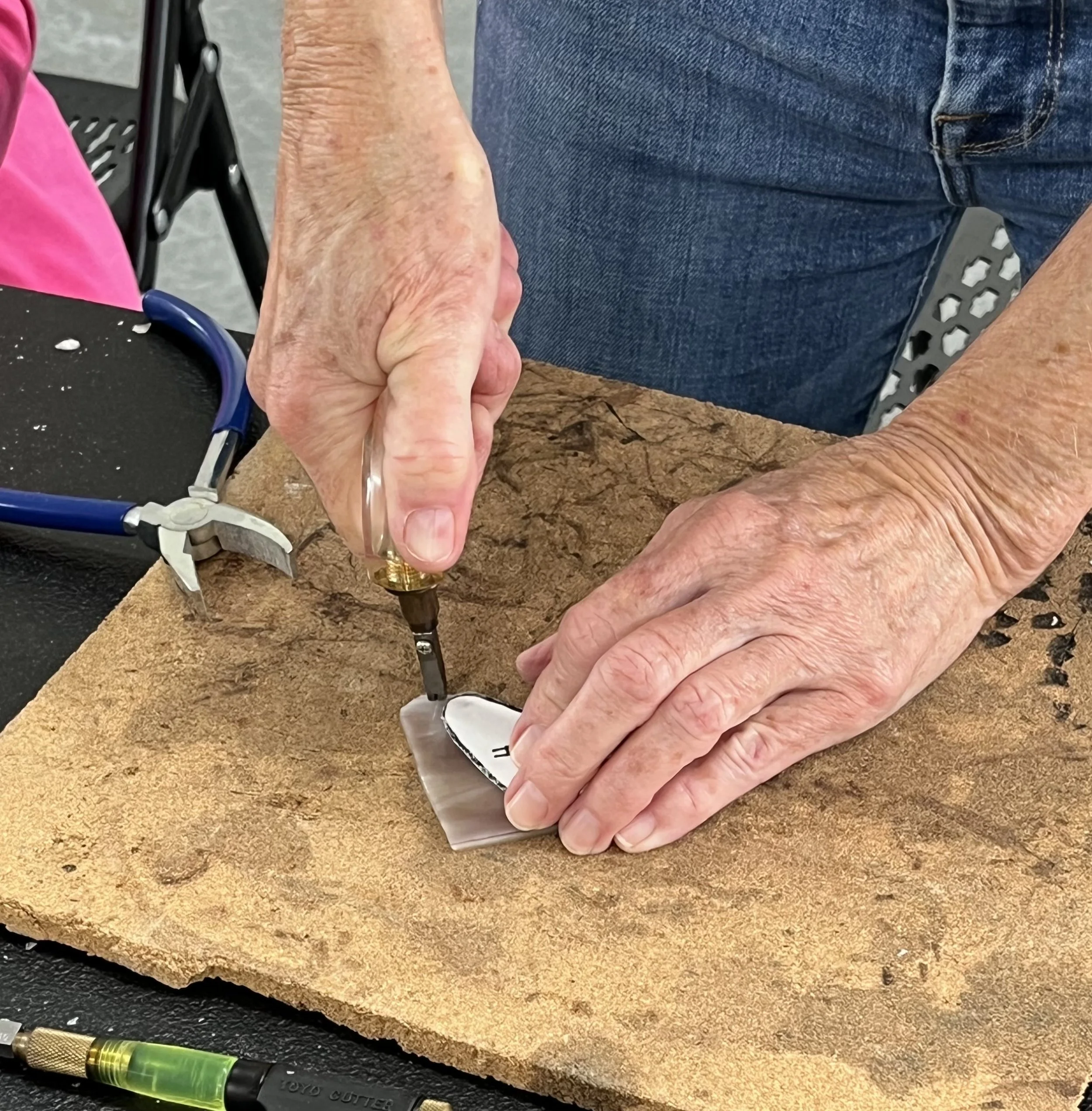 Student cutting glass Kim S Joy.jpg