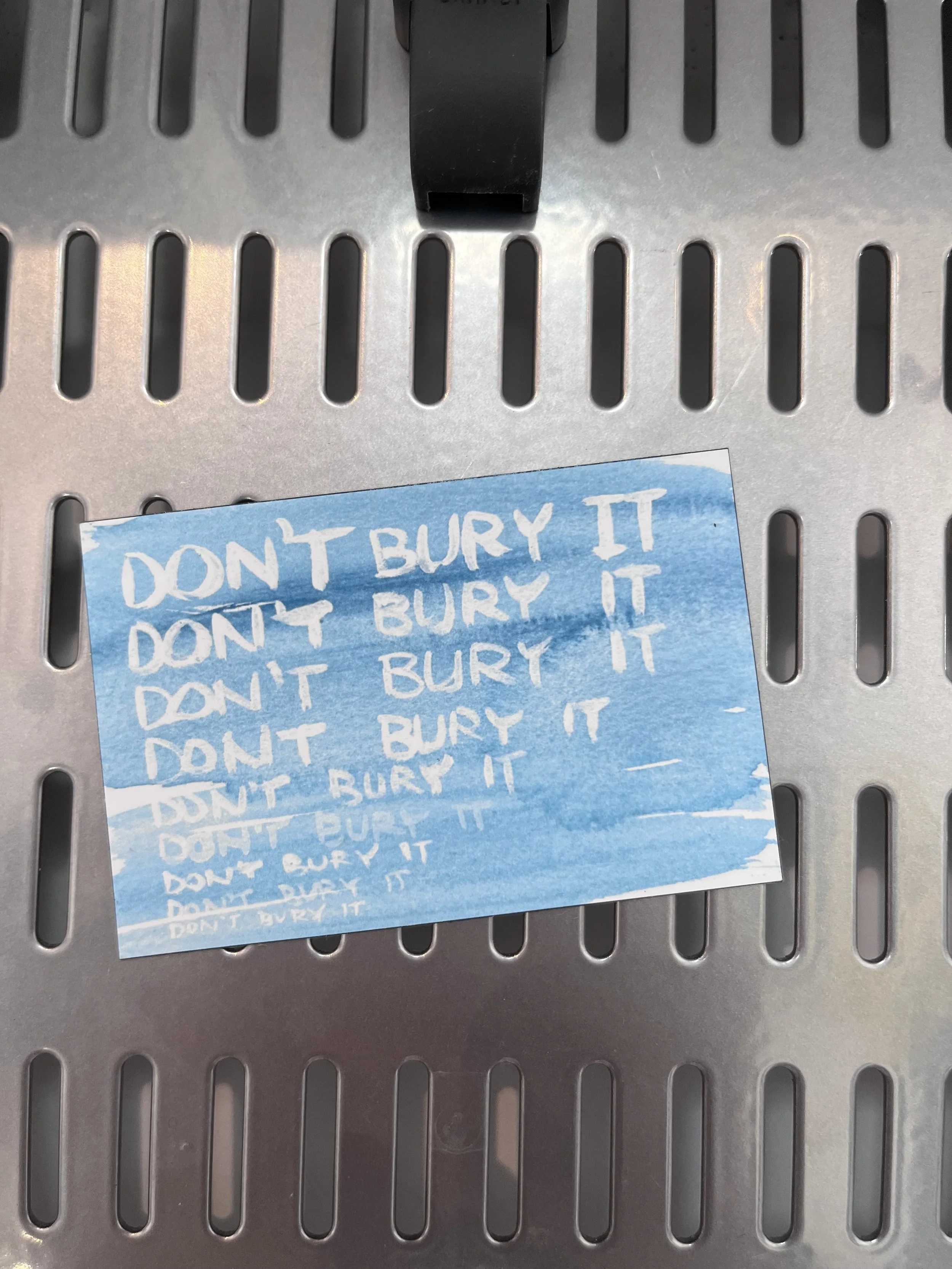 Dont bury it magnet painted words white type on blue background
