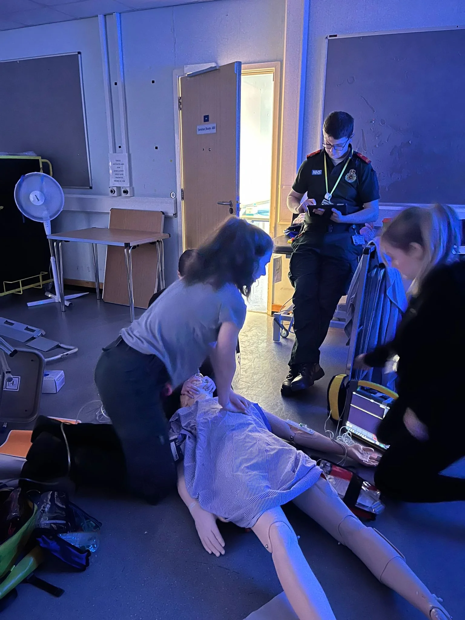 Performing CPR on a mannequin 