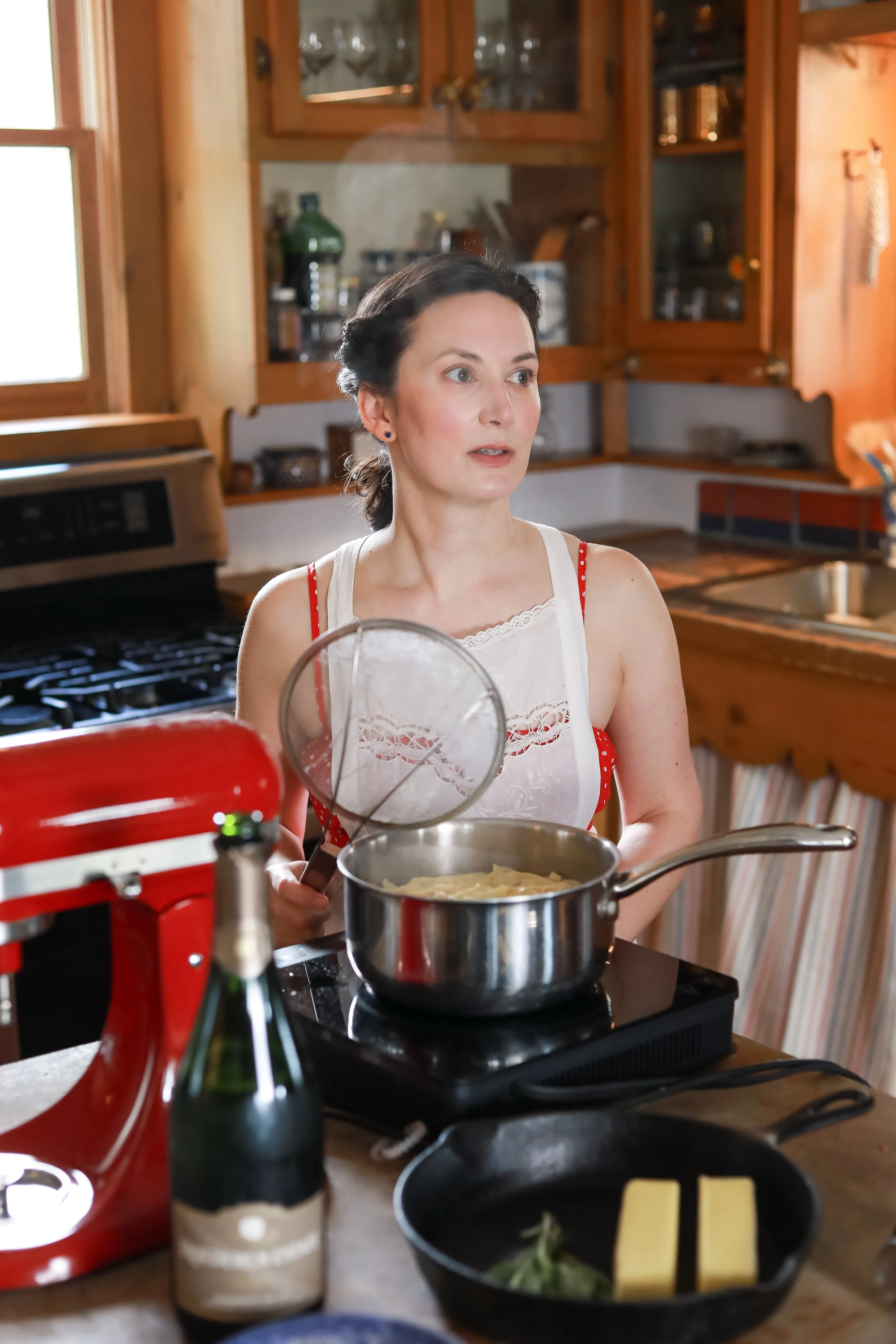 Florence-trained private chef preparing fresh pasta in a farmhouse kitchen in North Carolina