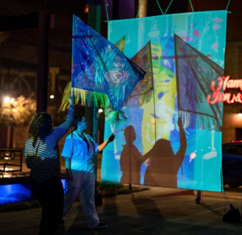 The weather may be windy but that just makes our flags fly. Join @this.is.yam and become a part of the art @mccno at Hall E. Grab a flag and show off your moves to the tunes of @i.am.funke photo by @bryceellphoto