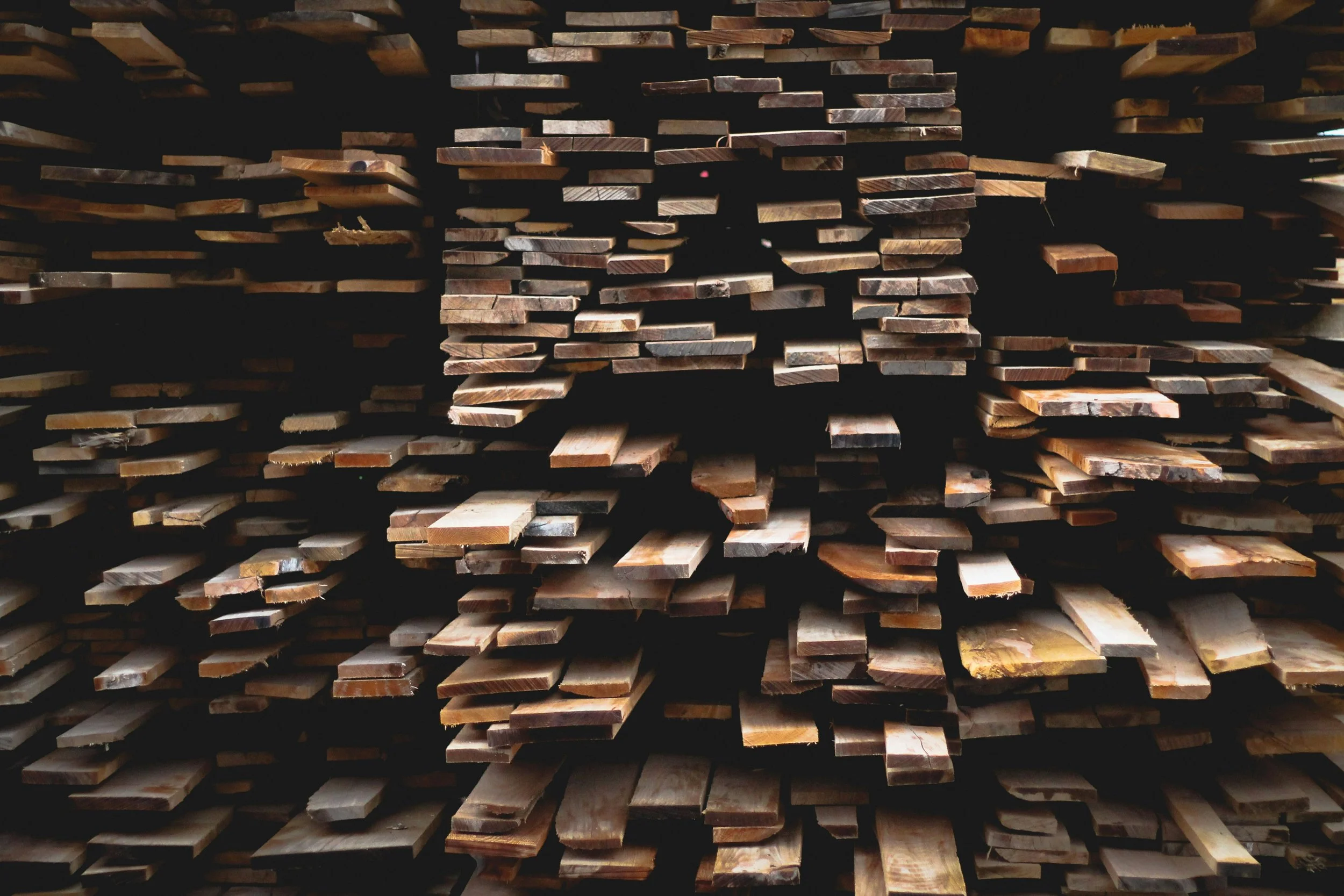 Stacks of wooden planks in a timber warehouse.