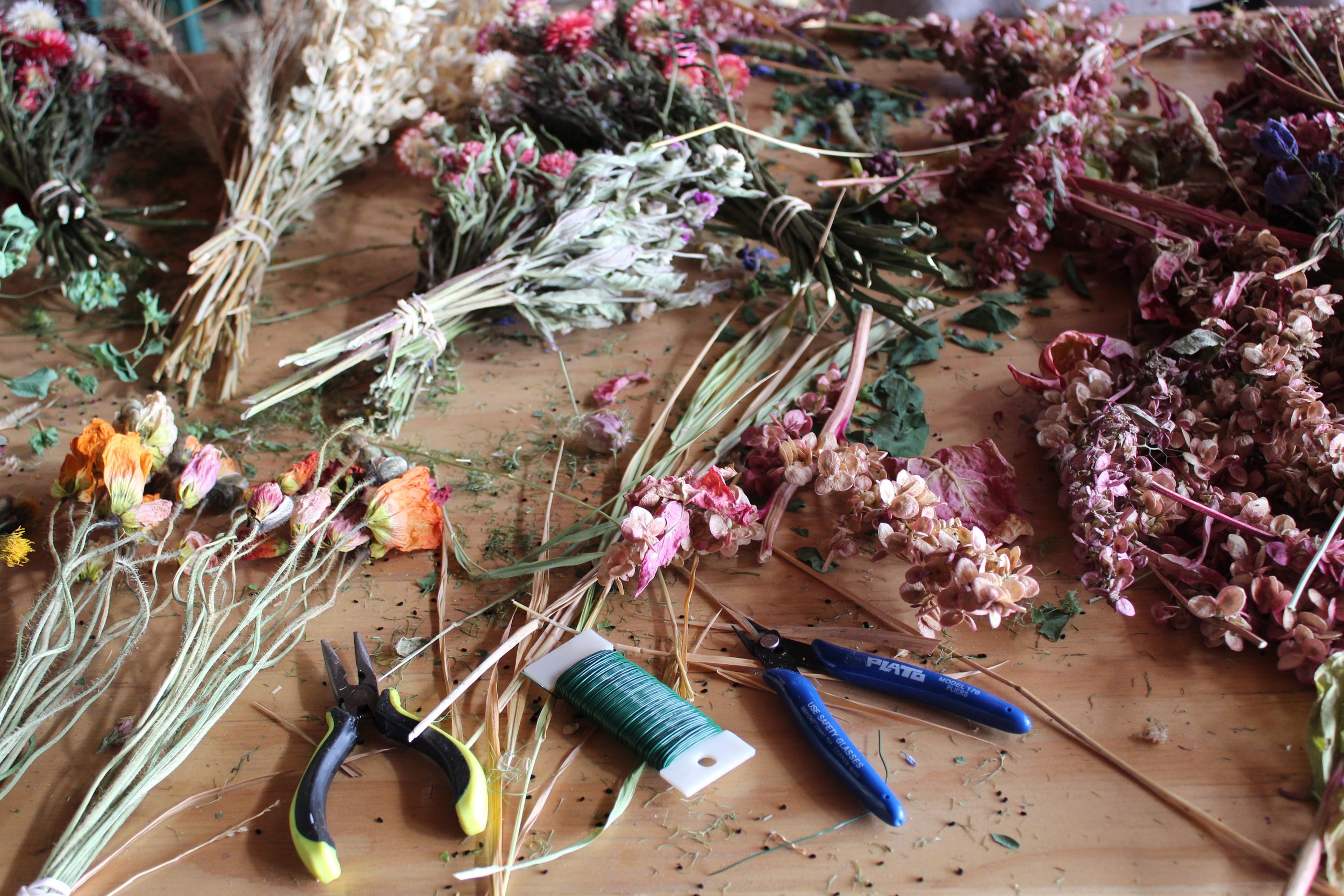 Tools and dried materials for a wreath-making workshop. Wreath workshops run from November to February.