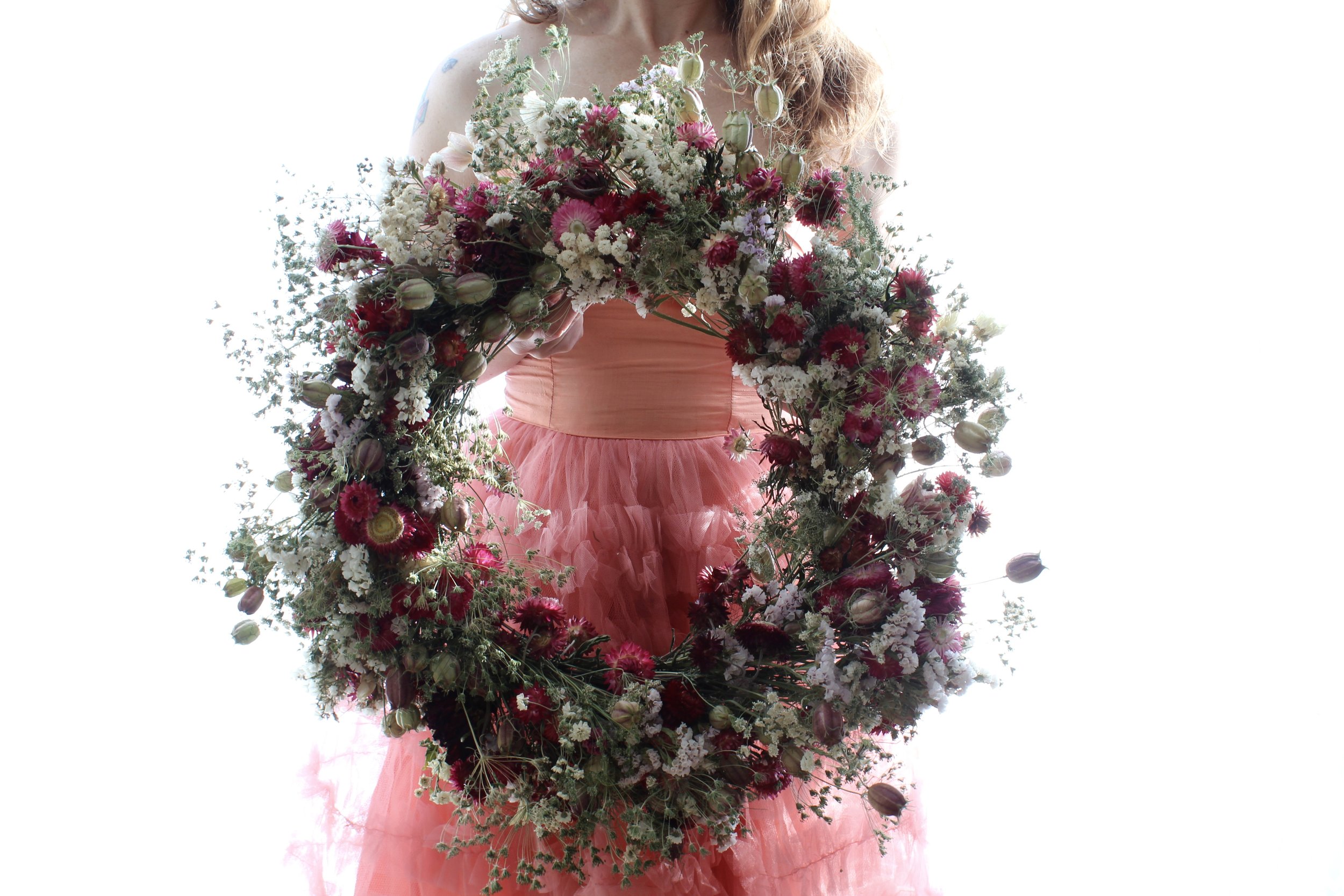 A dreamy February wreath made from garden-grown dried flowers.