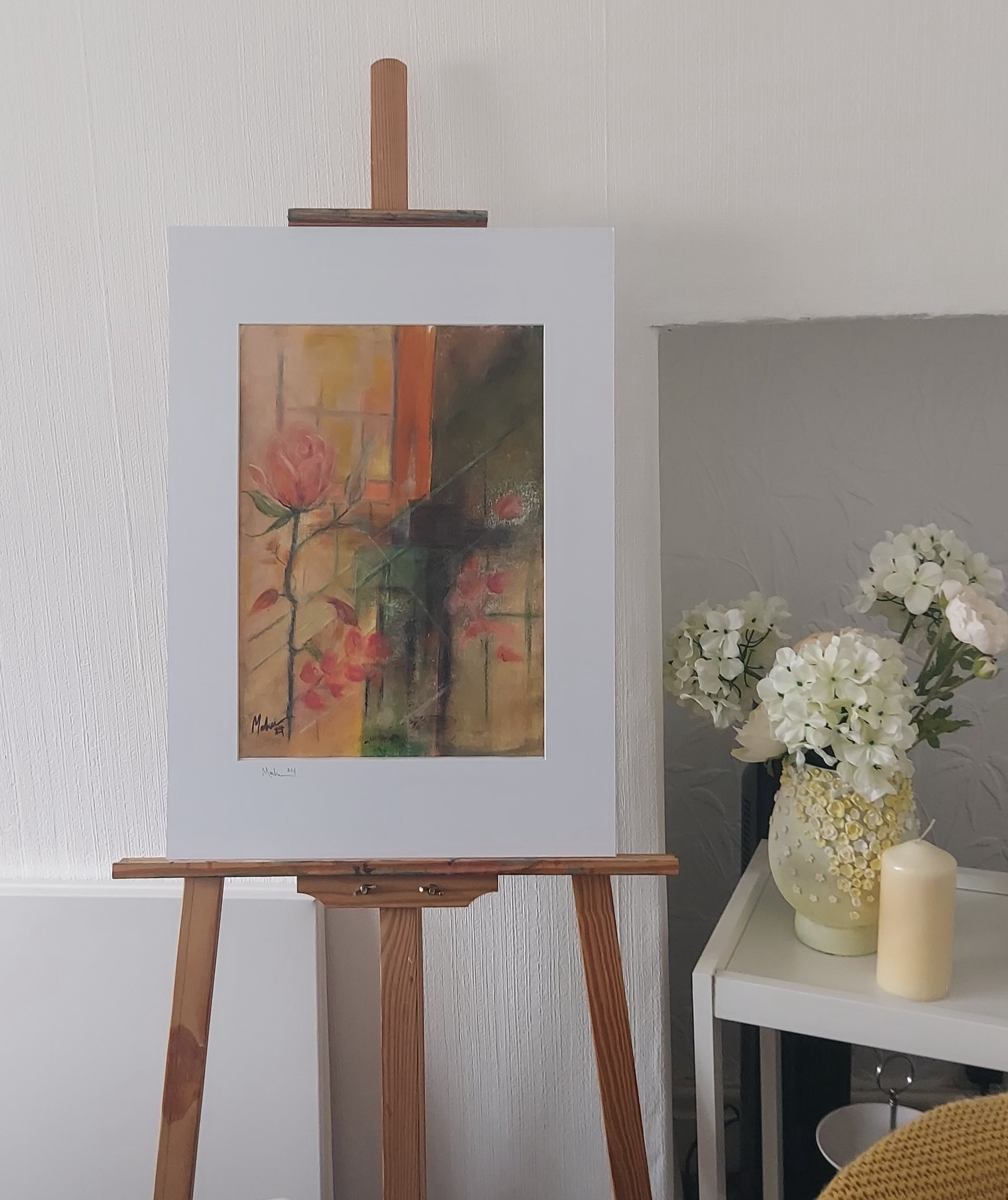 Autumn Rose painting in a white mount on easel to show the size of the painting
