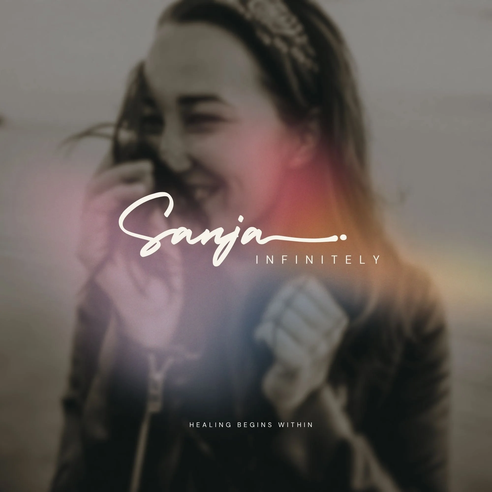 Hero image for Sanja Infinitely energy healing brand identity project featuring soft blurred portrait photography, atmospheric light gradients, and minimalist editorial typography designed for a spiritual wellness brand