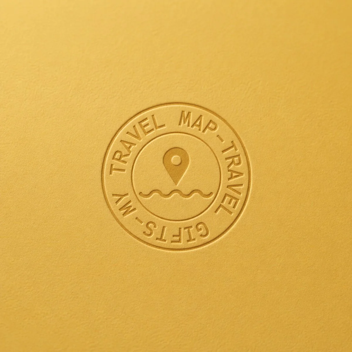 My Travel Map embossed logo mockup on textured yellow paper, showcasing a tactile brand identity for a travel gifts concept with a warm Mediterranean aesthetic.