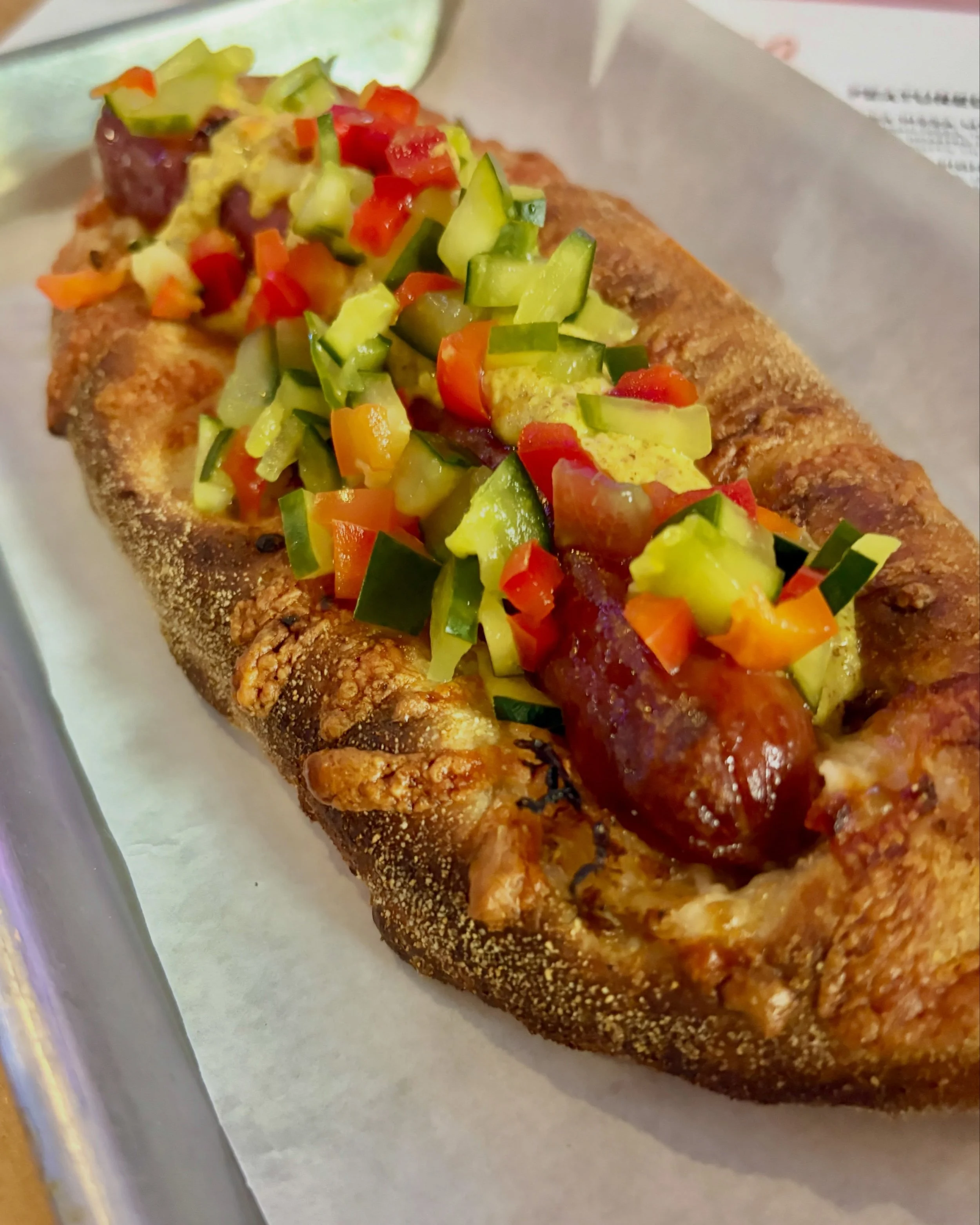 Is it even Memorial Day weekend if you don&rsquo;t have a hot dog?🌭The Lowry Dog is back: an all beef hot dog baked in our sourdough crust and topped with cheddar, sauerkraut, onion jam, and whole grain mustard.

Available for dine in, take out, or 