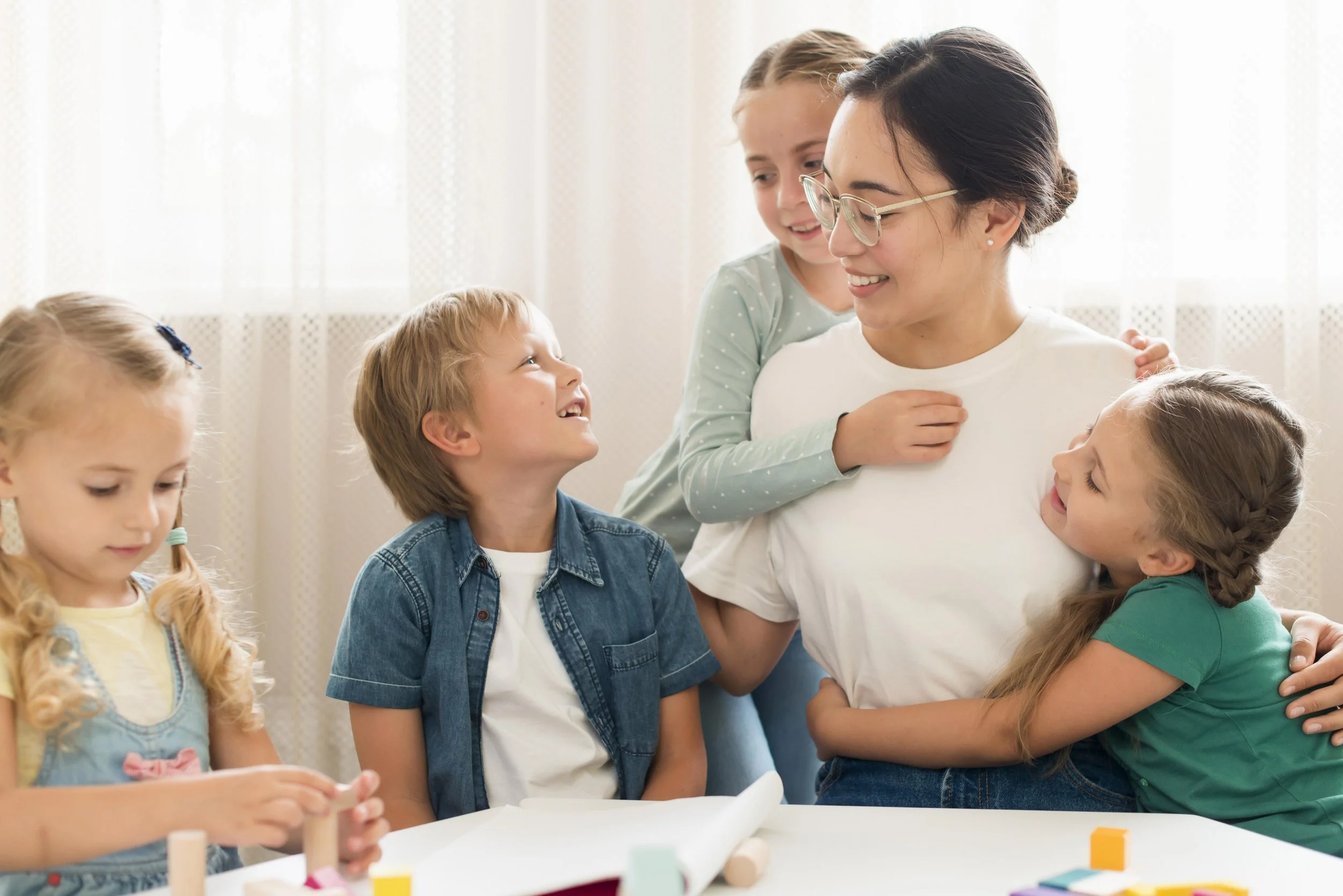 Kids hugging event nanny