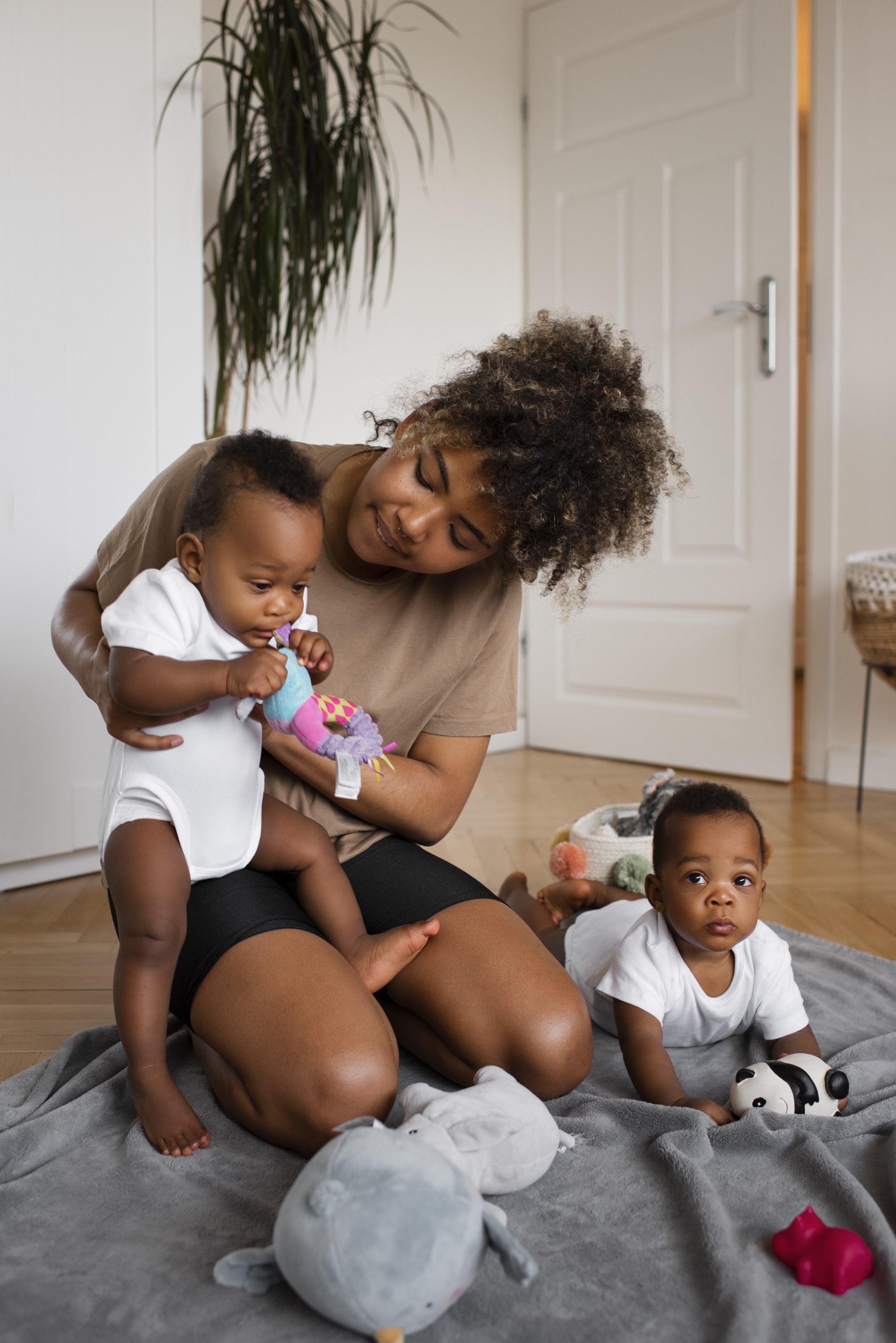 Babysitter caring for twin babies.