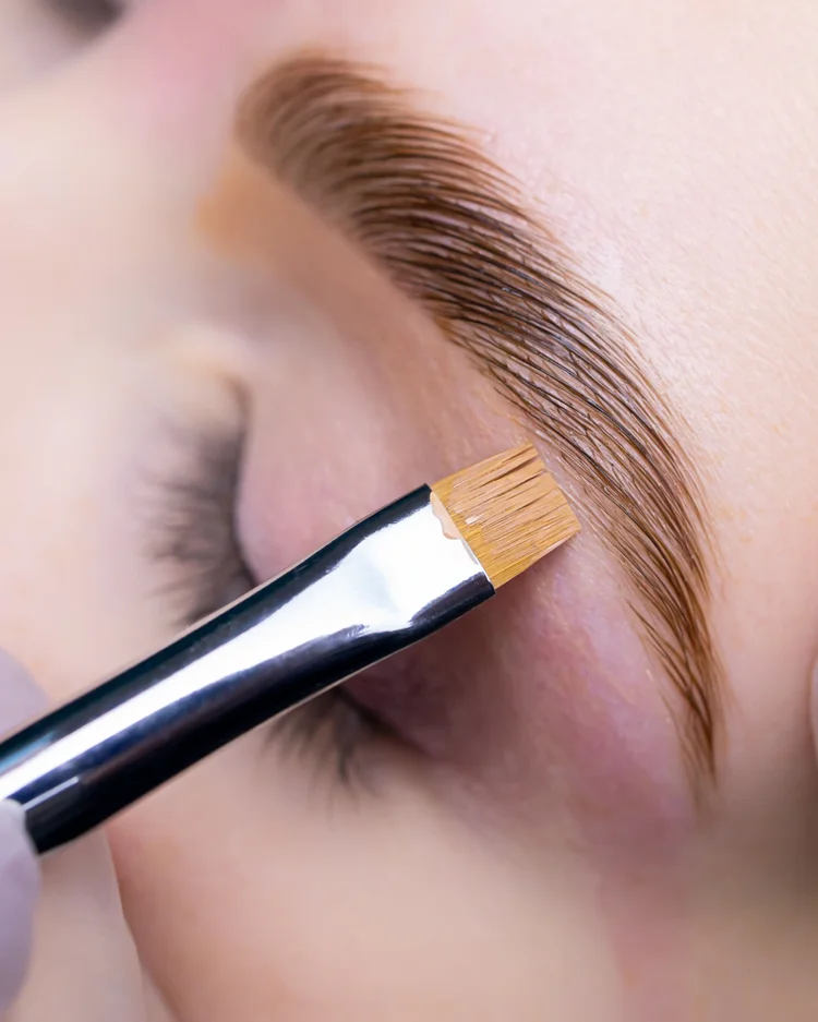 Brow lamination being brushed into shape
