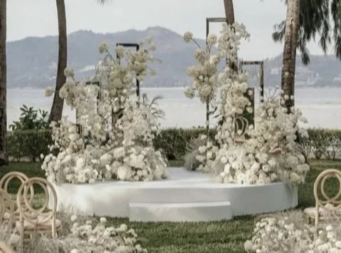 Our round stage showing a different display. This time draped in an arrangement of white flowers.