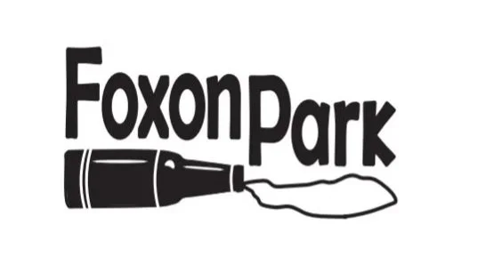 A black and white logo showing the text "Foxon Park" with a bottle pouring liquid underneath.