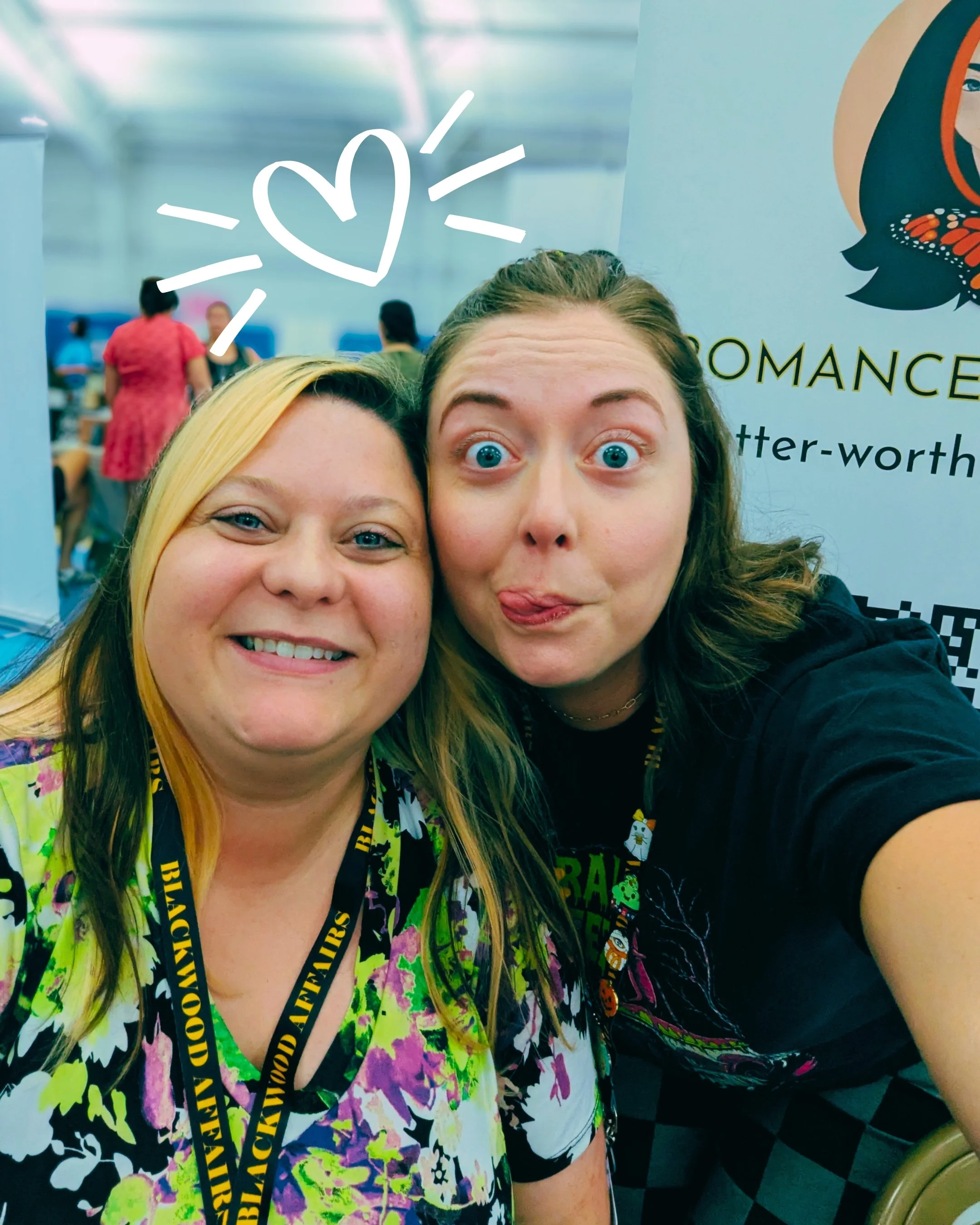 Picture of Lindsey Montgomery and author, Meghan Monarch, at Pages of Glass doing a funny face