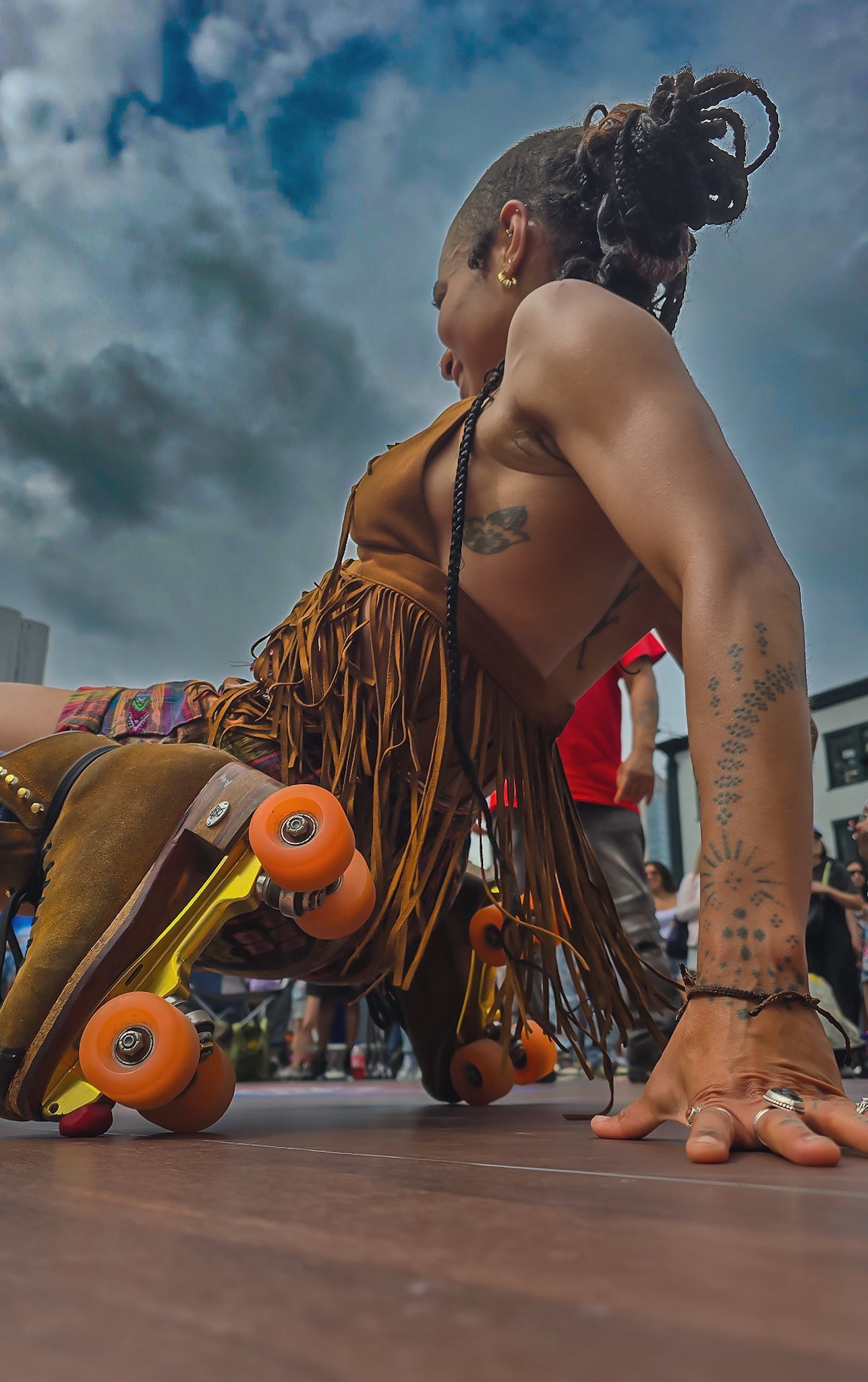 Genesis the roller skating guru and tattoo artist on her skates at Bastid's BBQ, NYC 2025