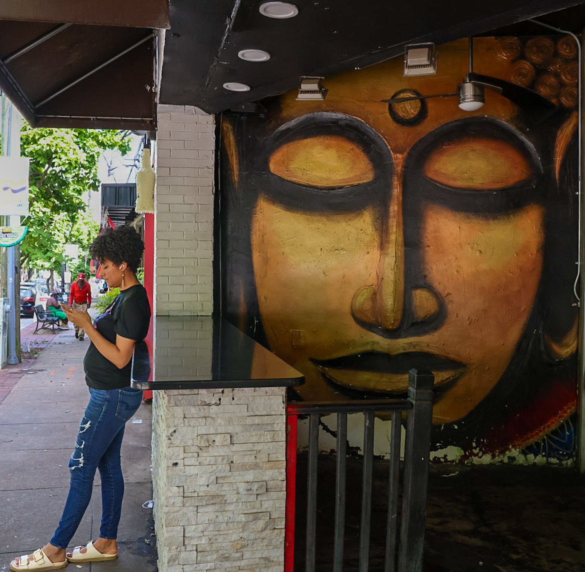 As I took this picture of street art in East Atlanta. I captured a creative in frame, Gabrielle Zalina.