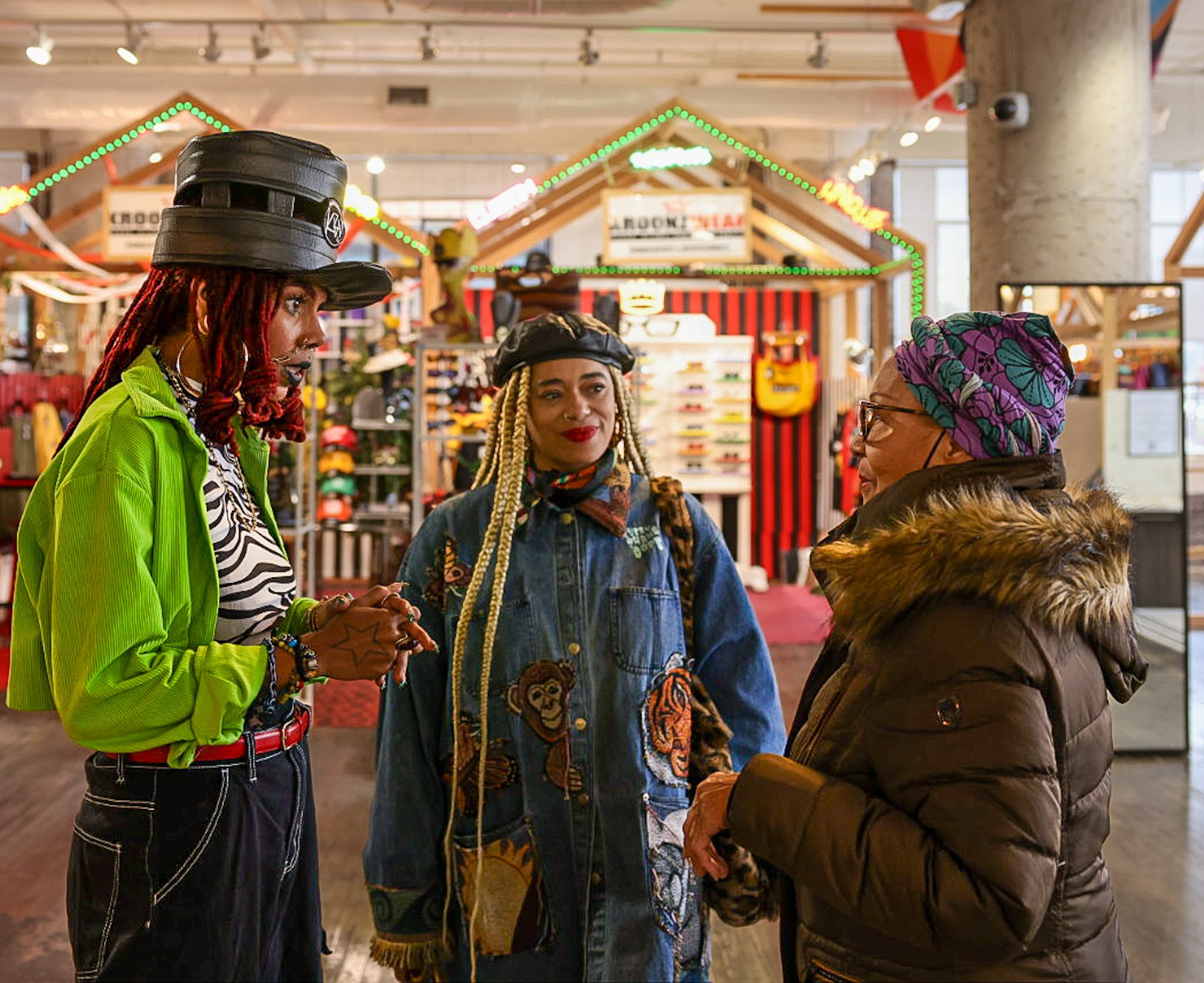 Three creatives conversing at the Ponce Market, Atlanta.