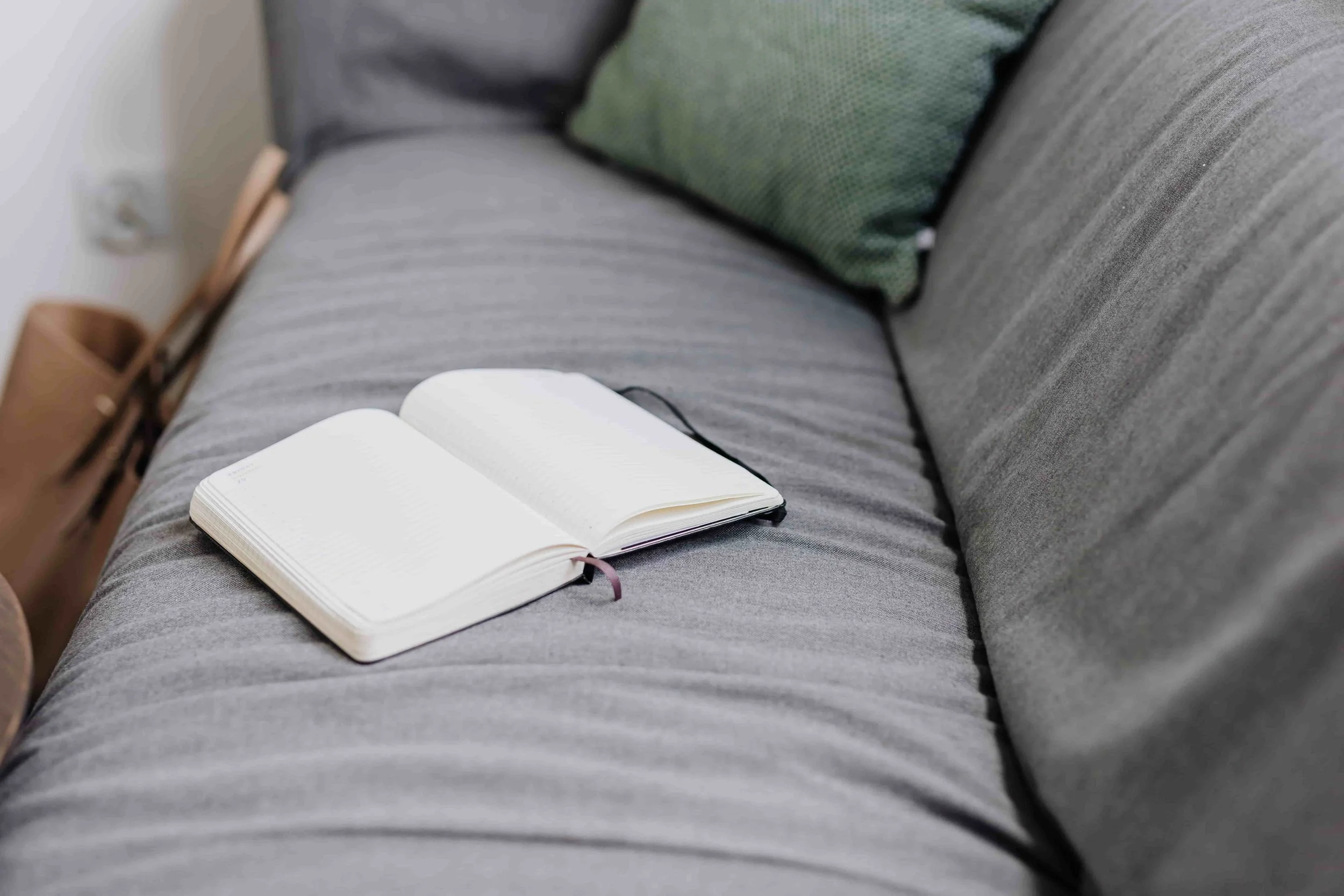 cozy couch  with journal sitting on top