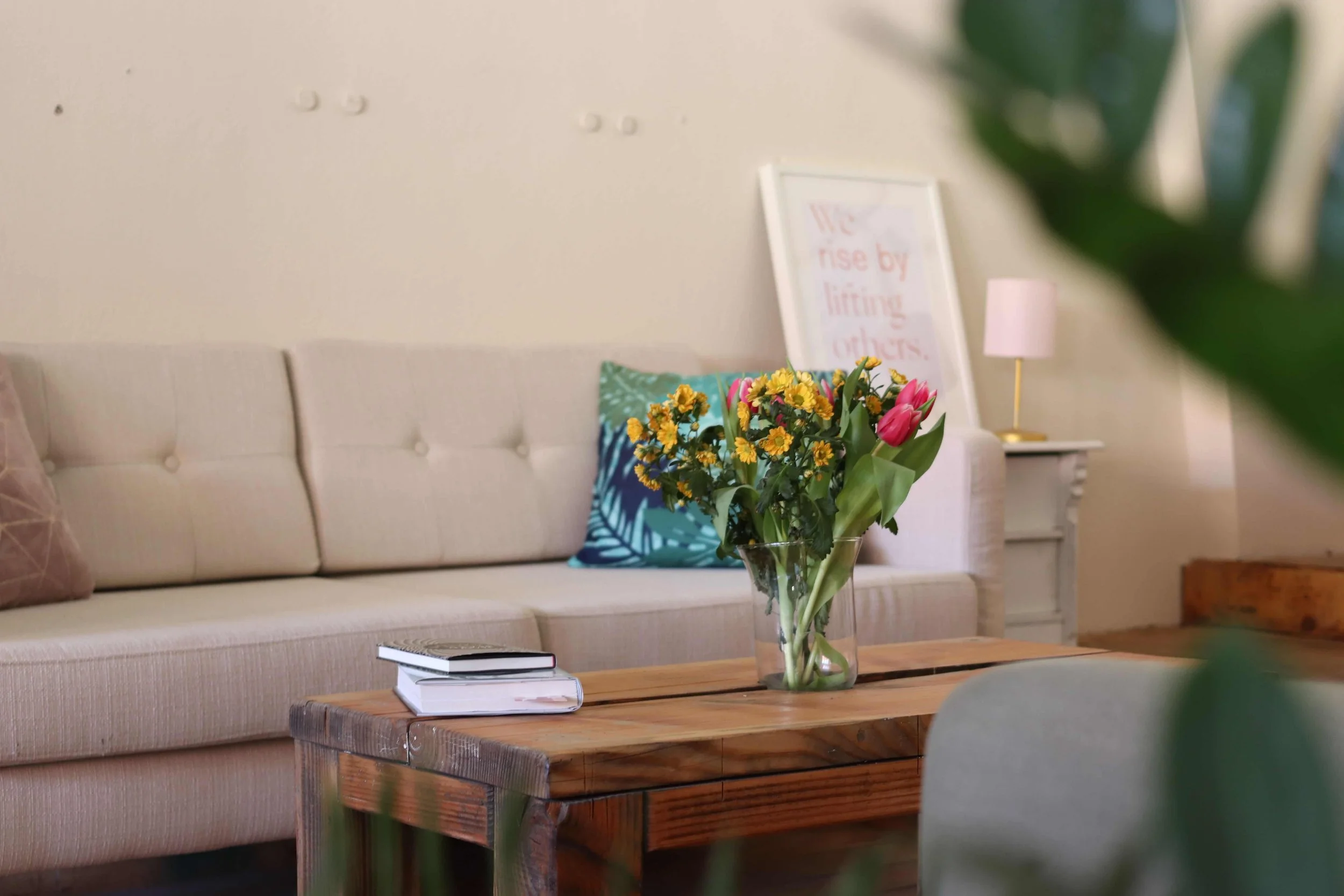 When Weekly Therapy Isn't Enough: Is an Intensive Right for You? - Therapy office with couch and flowers on coffee table