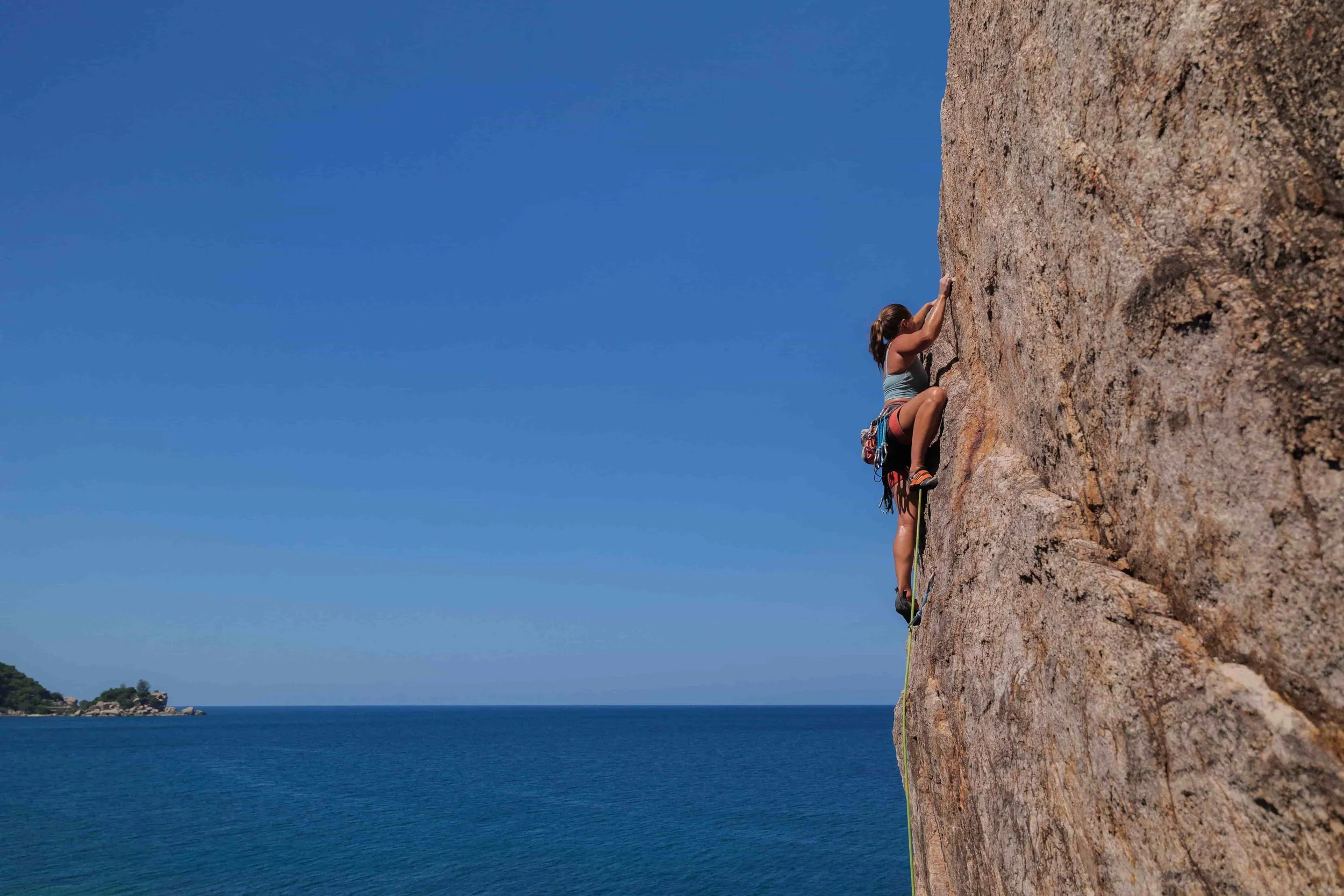 Why Trauma Healing Isn’t A Linear Process - woman rock climbing
