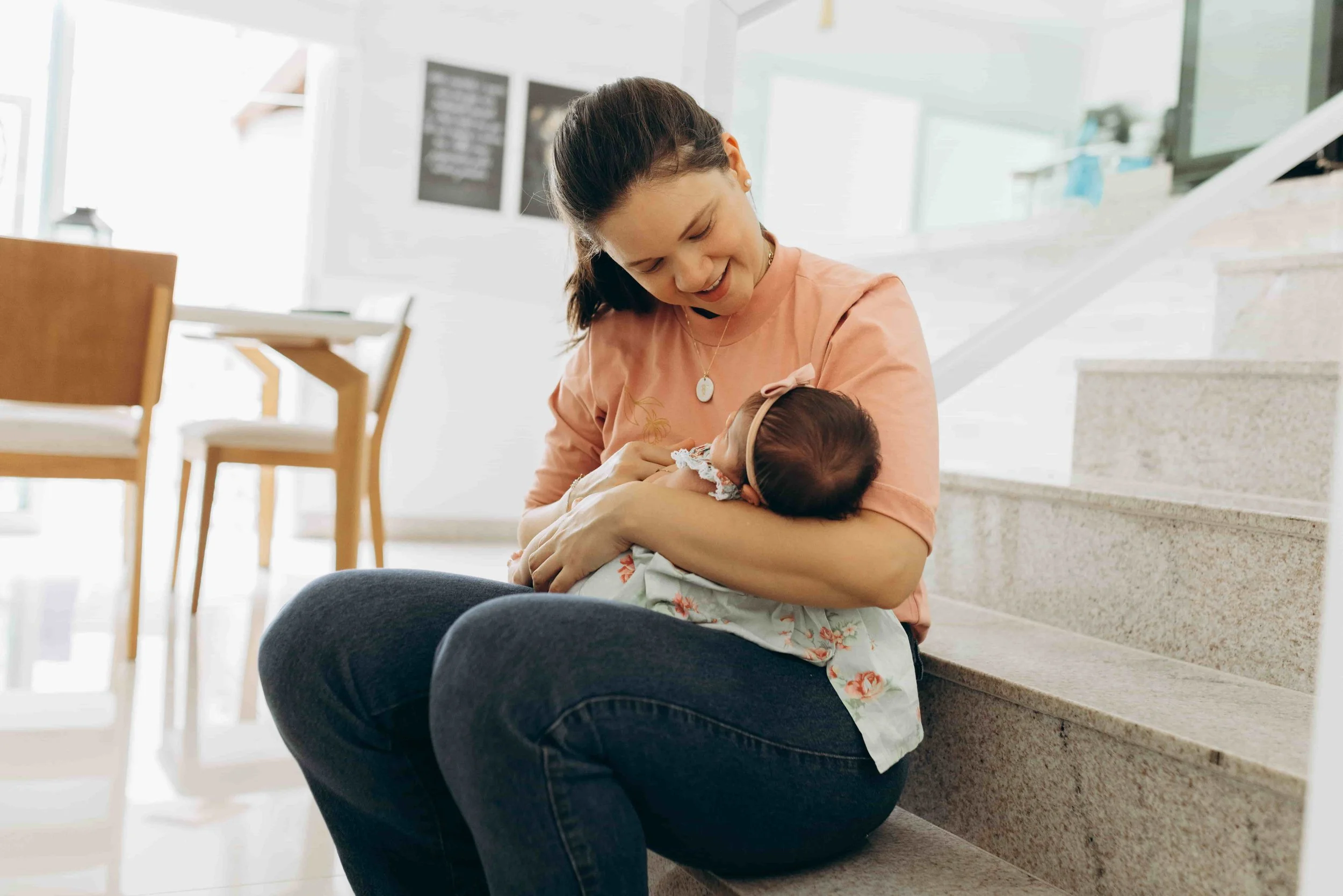 Mom holding a newborn baby- Support Options for Moms During Pregnancy & Postpartum