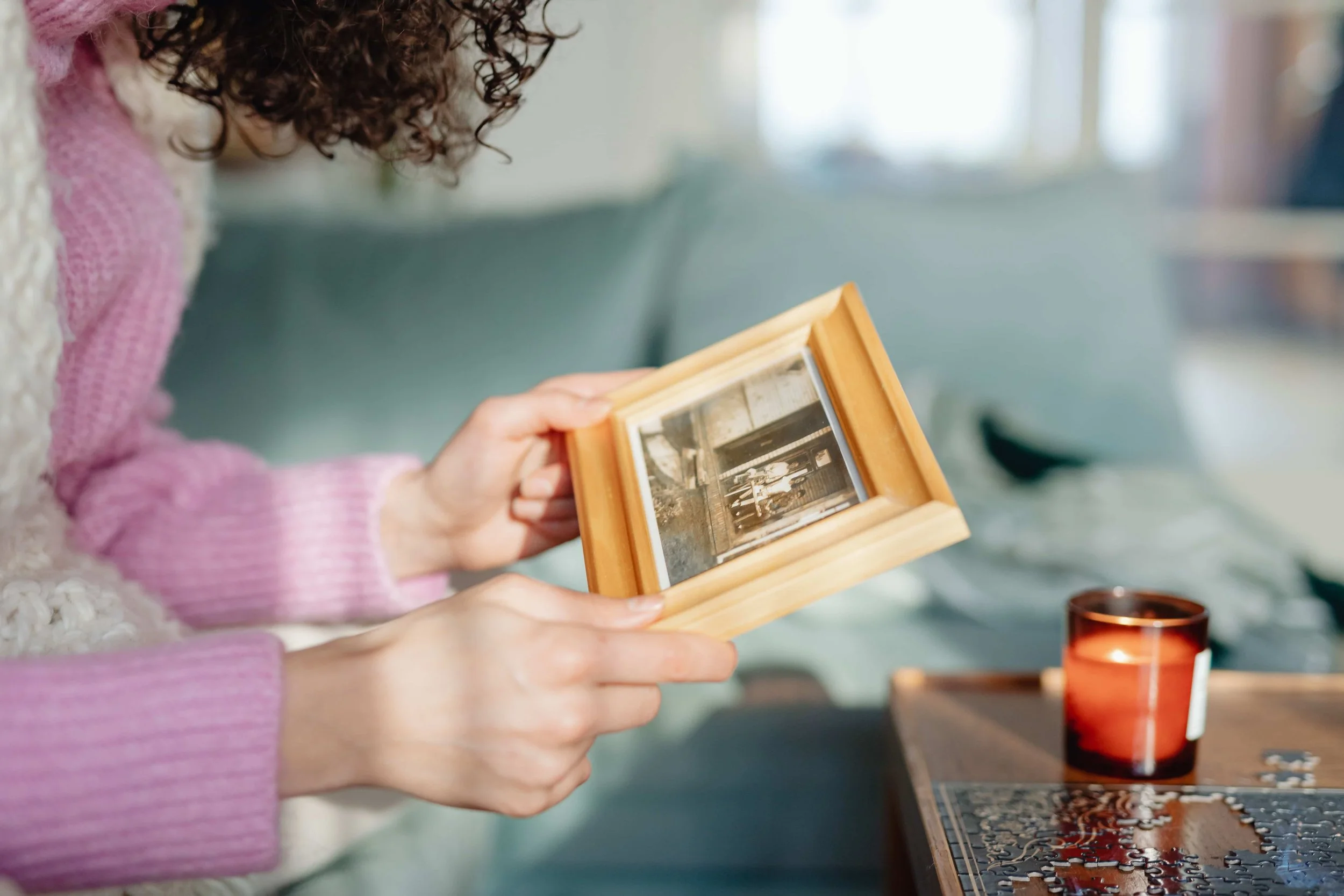 When EMDR Is Often Recommended in Trauma Treatment- Woman looking at black and white picture in a frame